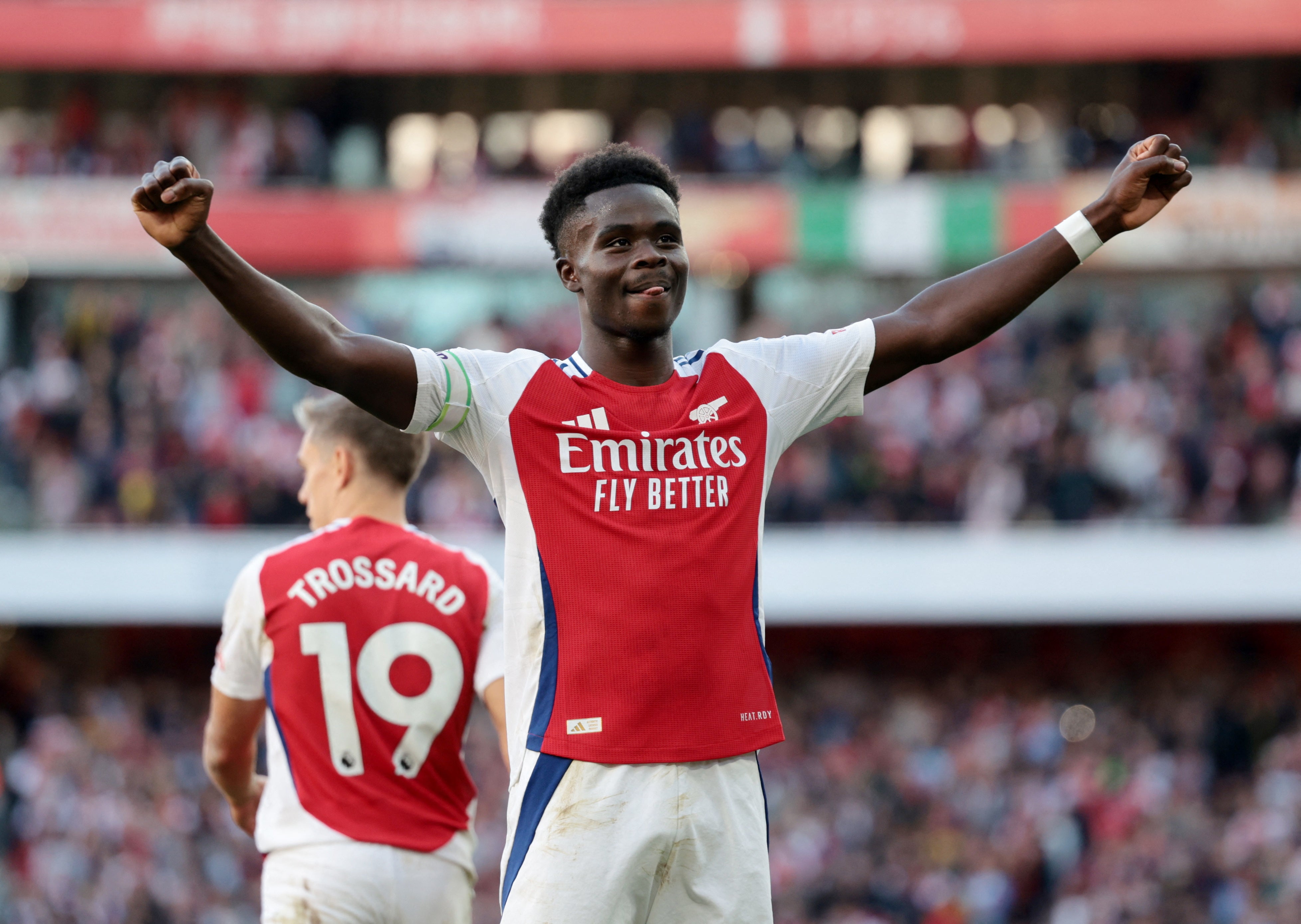 Bukayo Saka celebrates in front of Arsenal’s fans