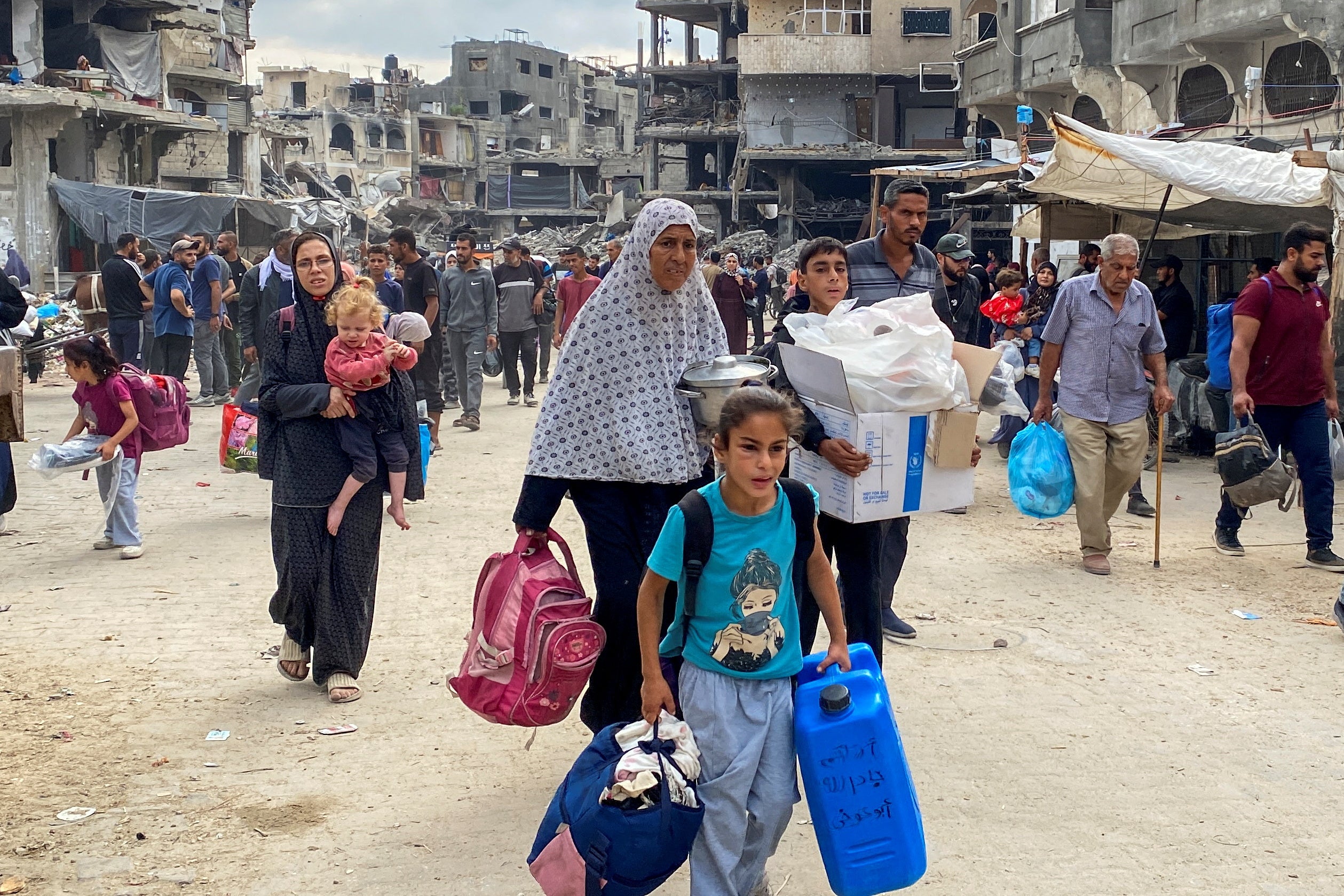 Displaced Palestinians flee areas in northern Gaza Strip following an Israeli evacuation order