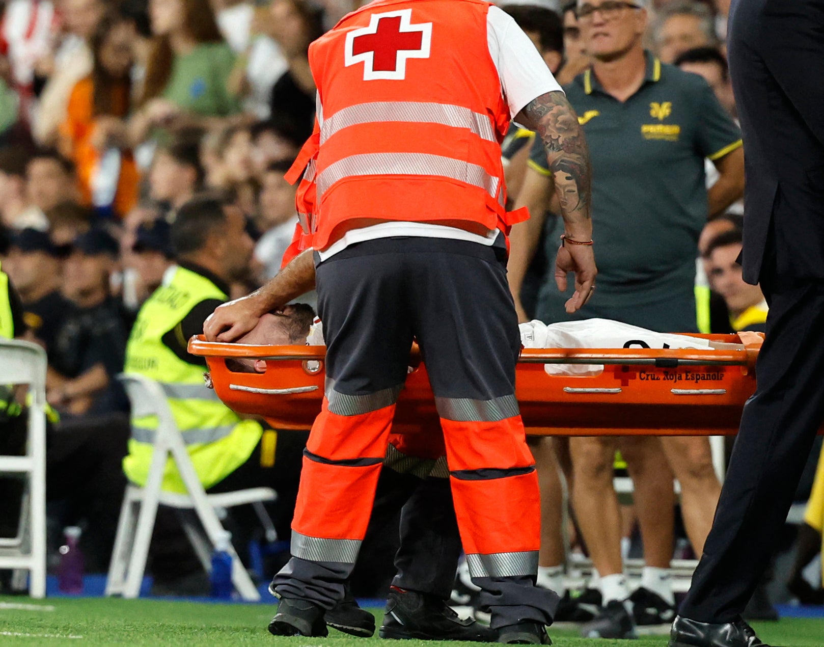 Dani Carvajal is carried off the pitch on a stretcher