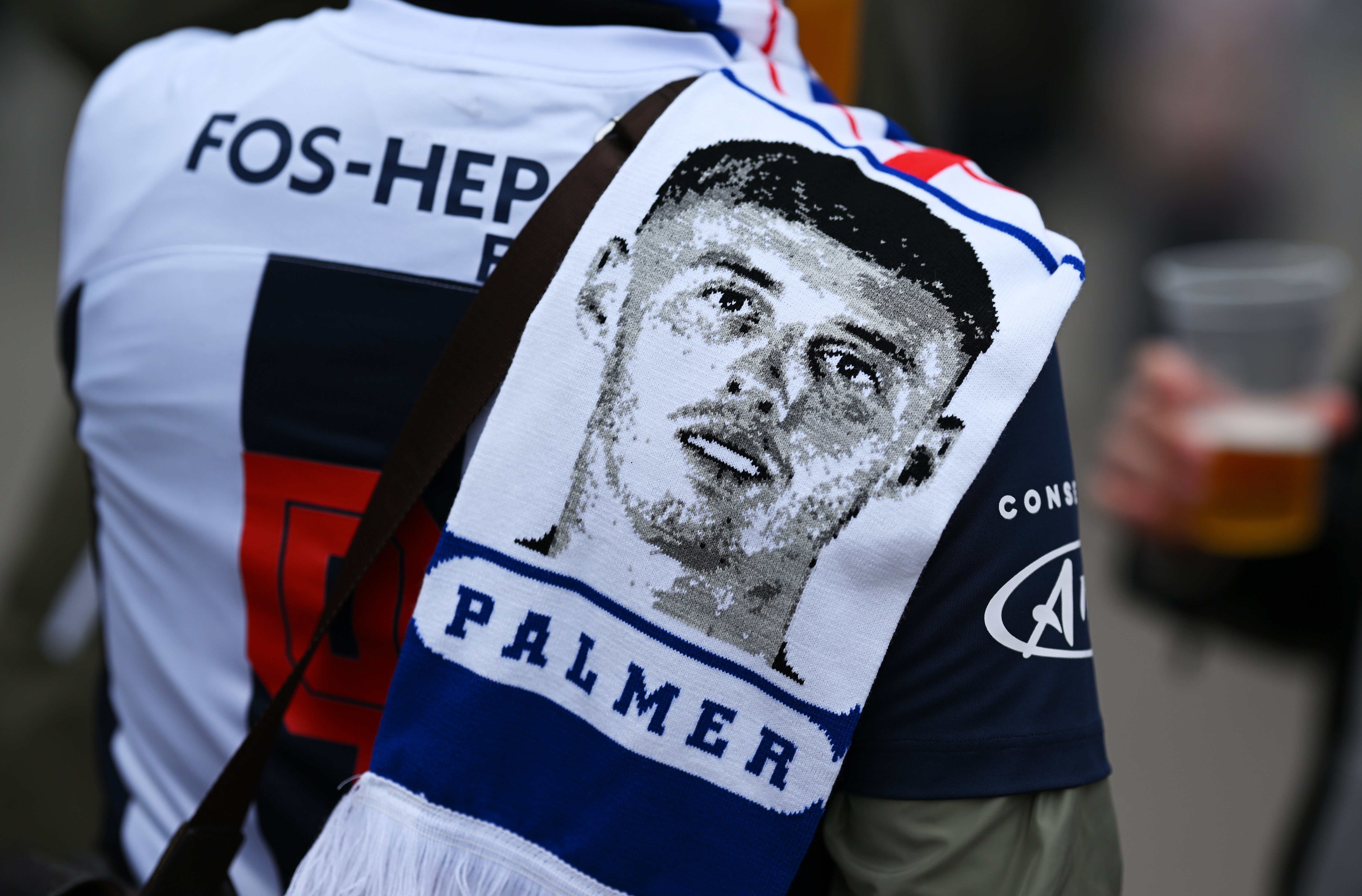 A fan sports a Cole Palmer scarf