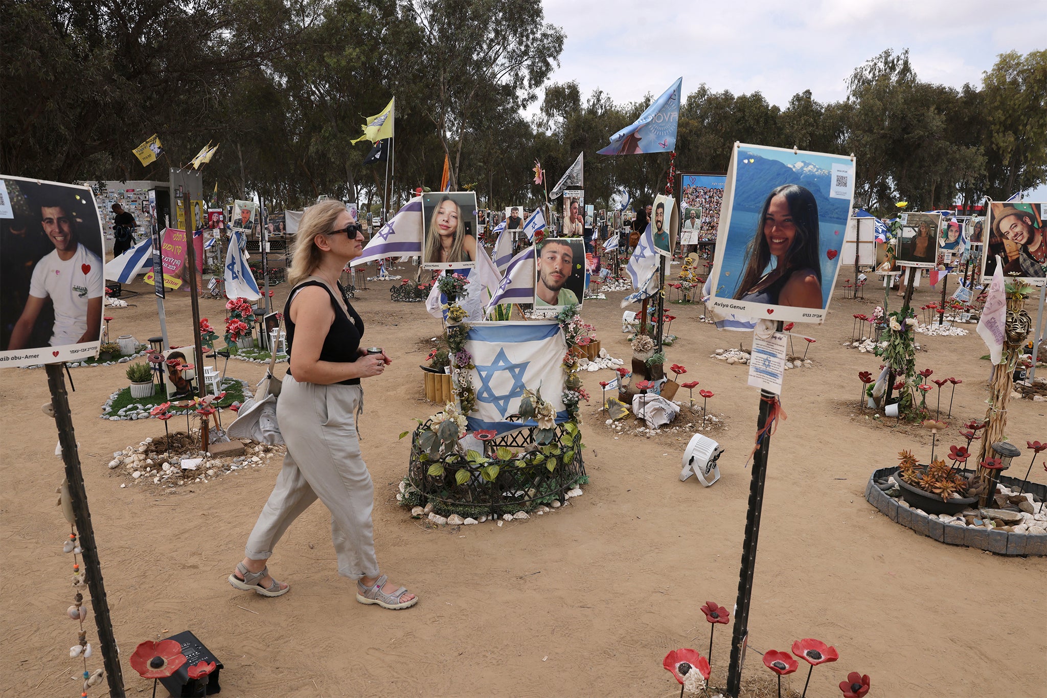 A woman visits an installation honouring those who were killed and kidnapped in the Supernova music festival