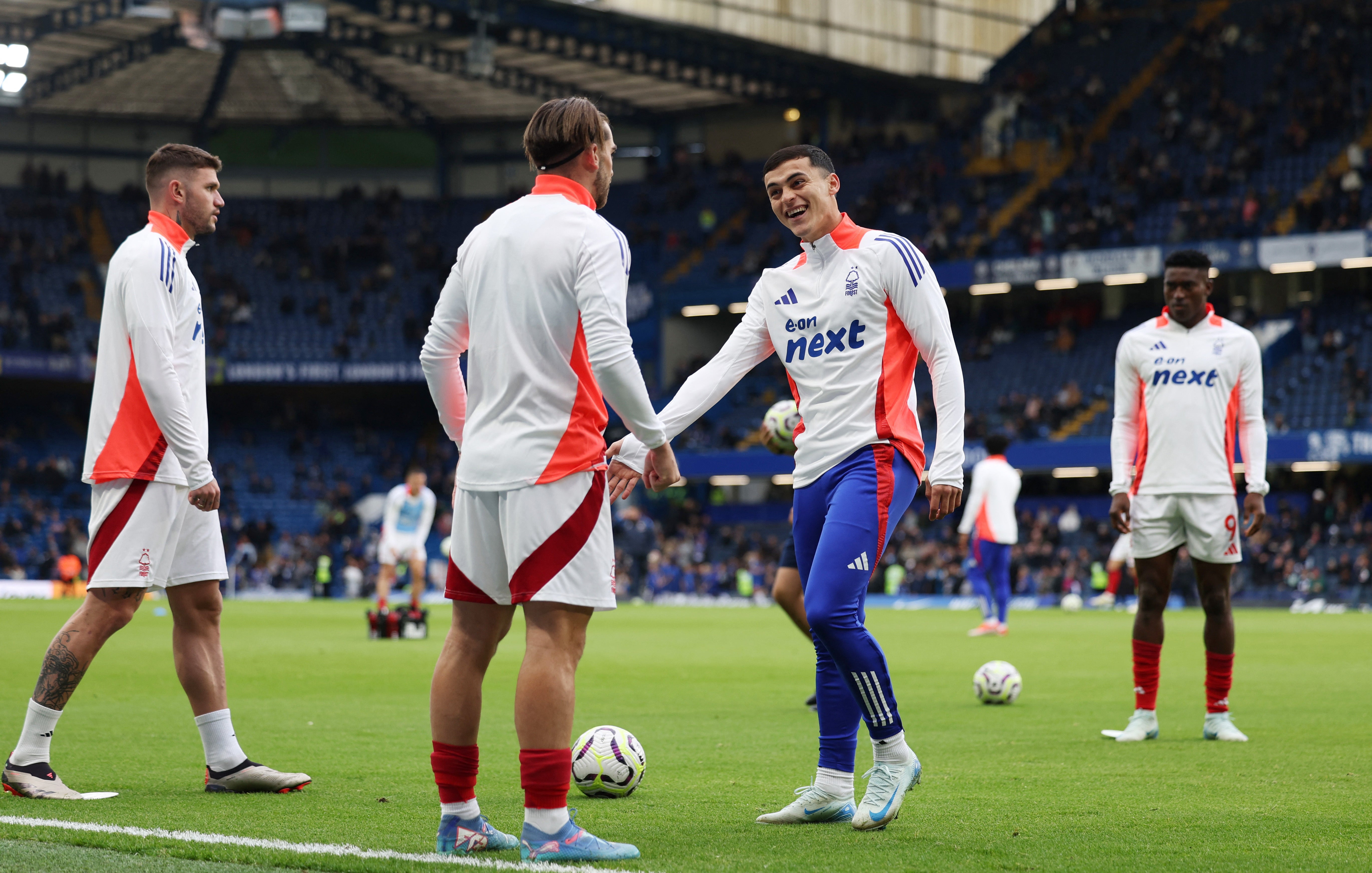 Forest players warm up at Stamford Bridge before kick-off