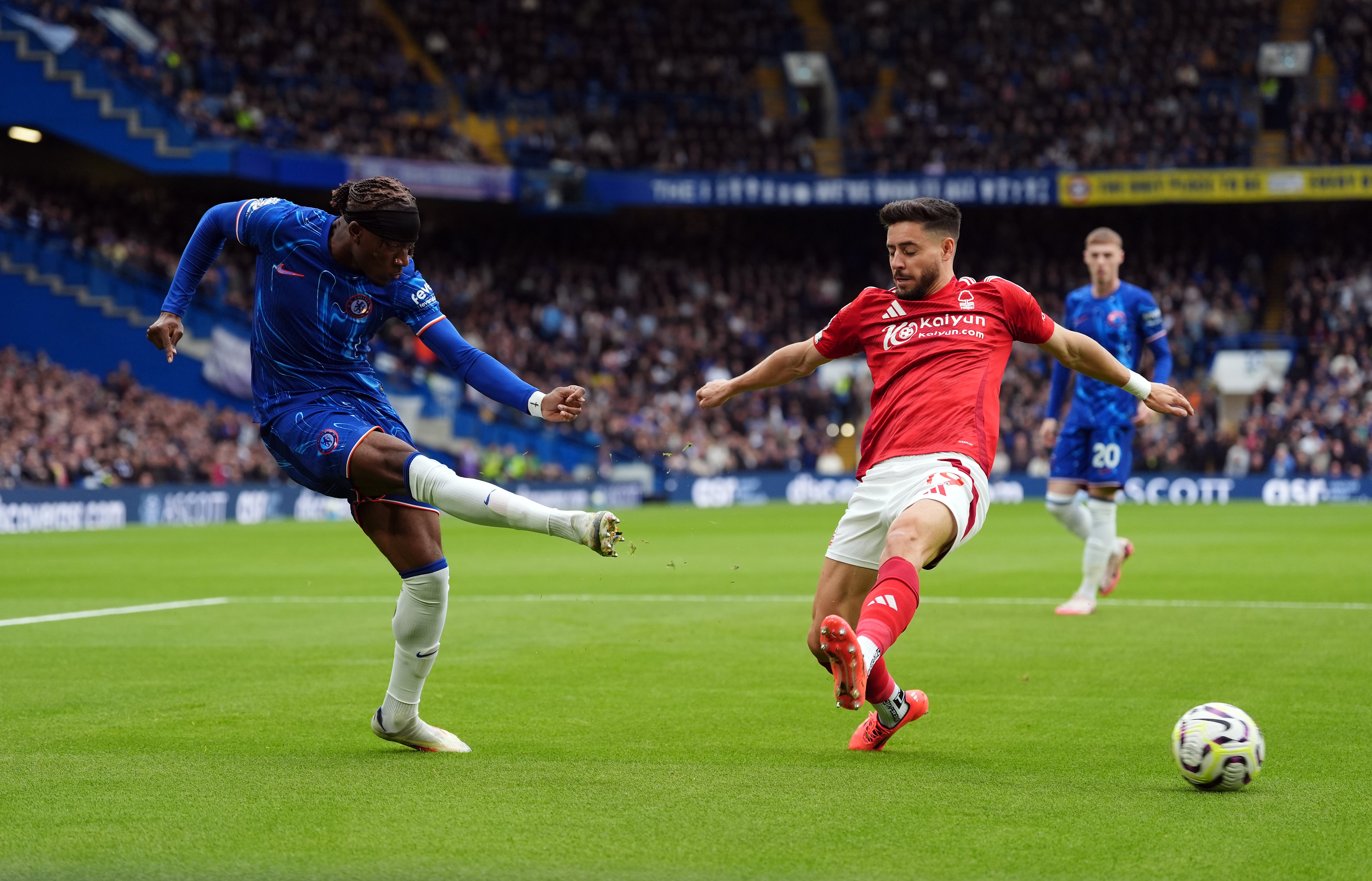 Noni Madueke takes on Nottingham Forest's Alex Moreno