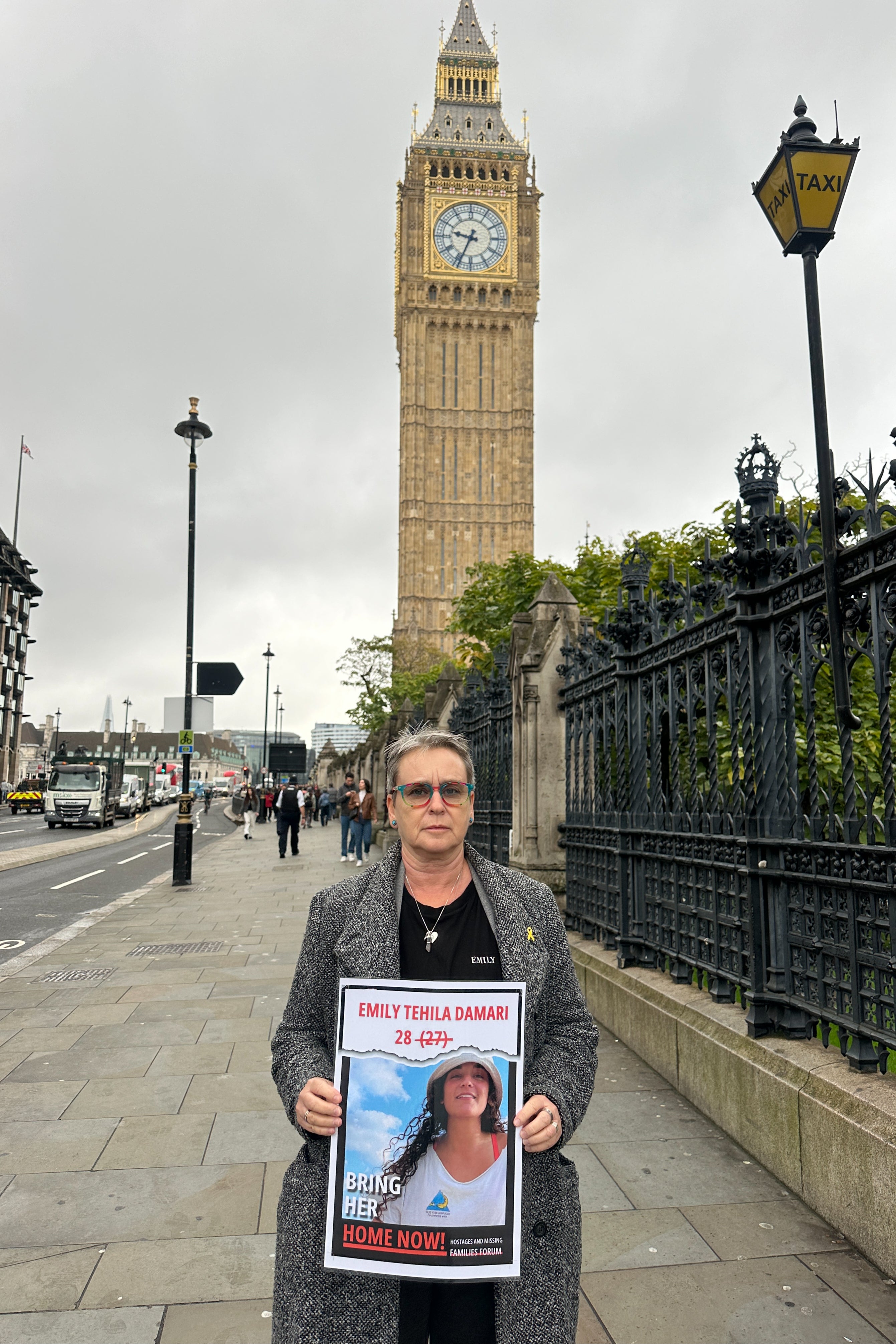 Mandy Damari holds a poster beneath Big Ben calling for daughter’s release during a recent visit to London