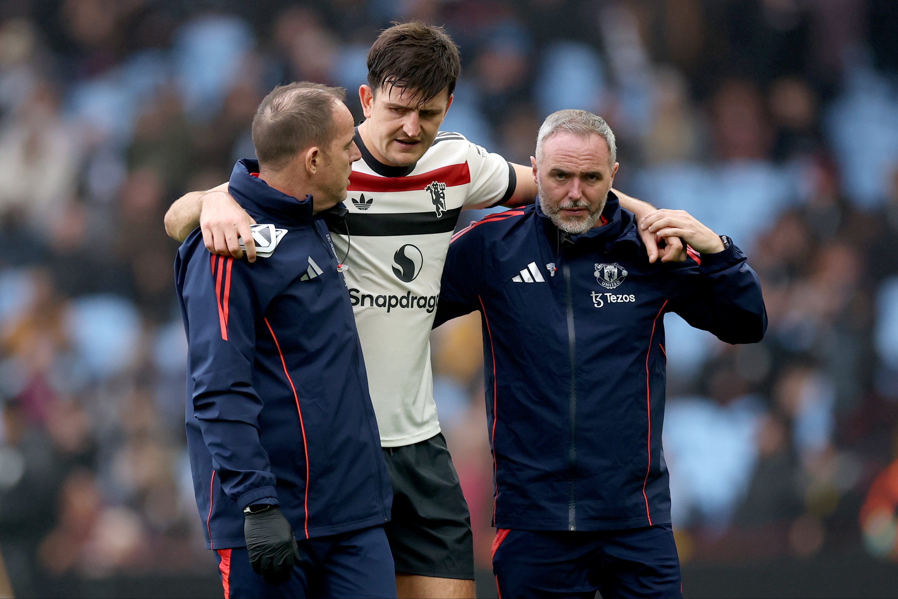 Harry Maguire had to be helped off the Villa Park pitch