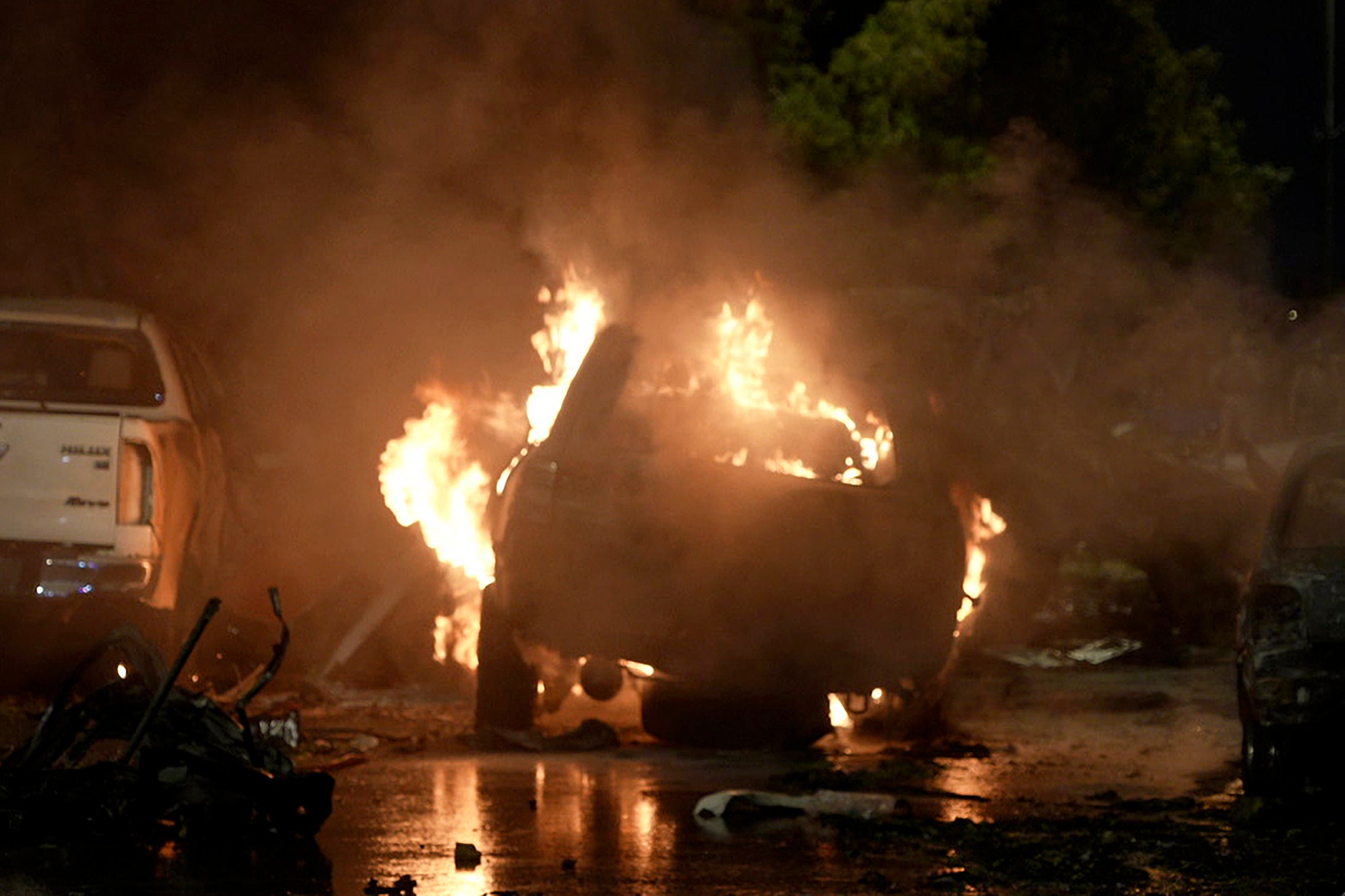 A vehicle is seen on fire after an explosion outside the Karachi airport in Pakistan on 6 October 2024