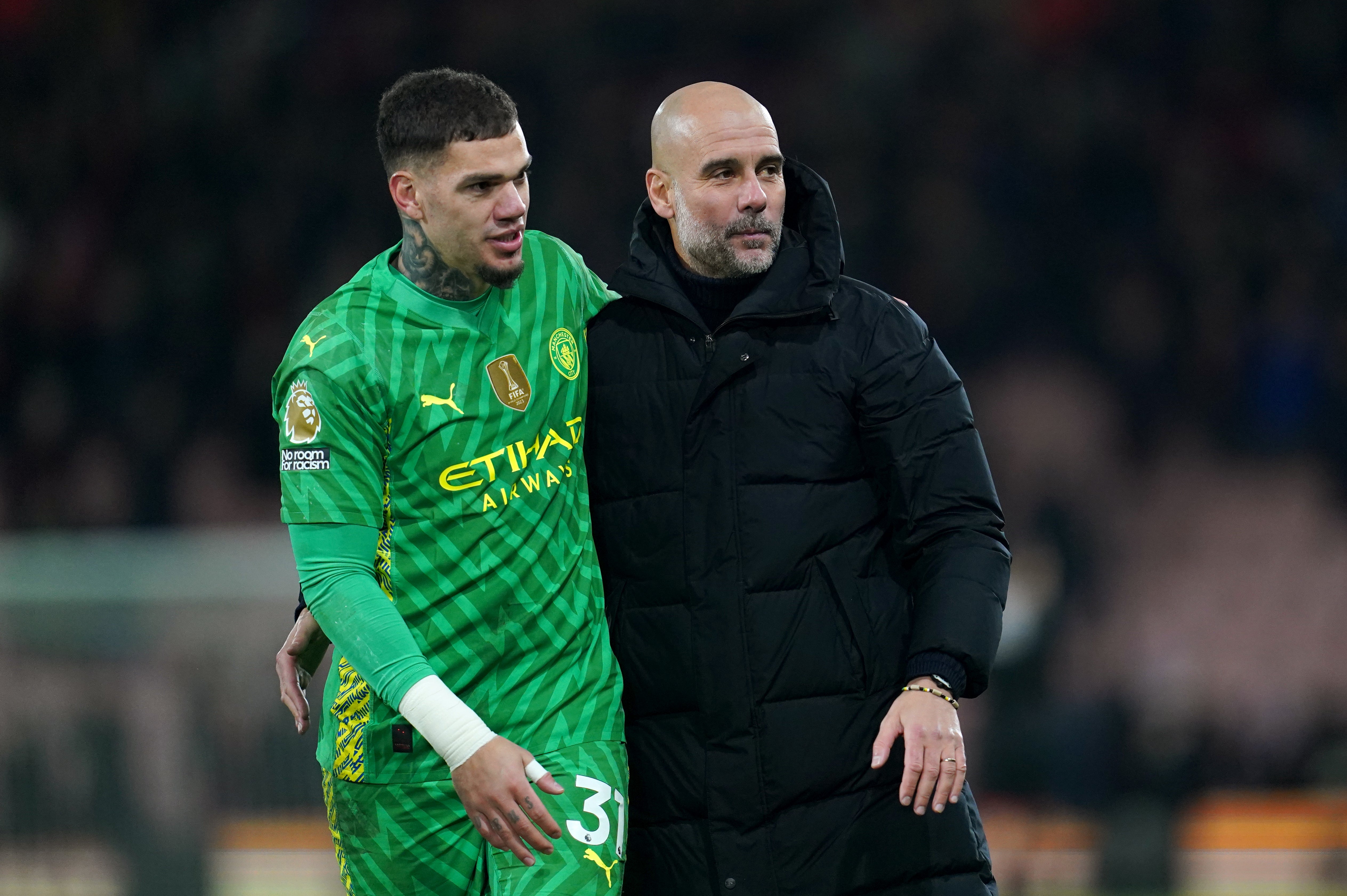 Pep Guardiola (right) with Manchester City goalkeeper Ederson