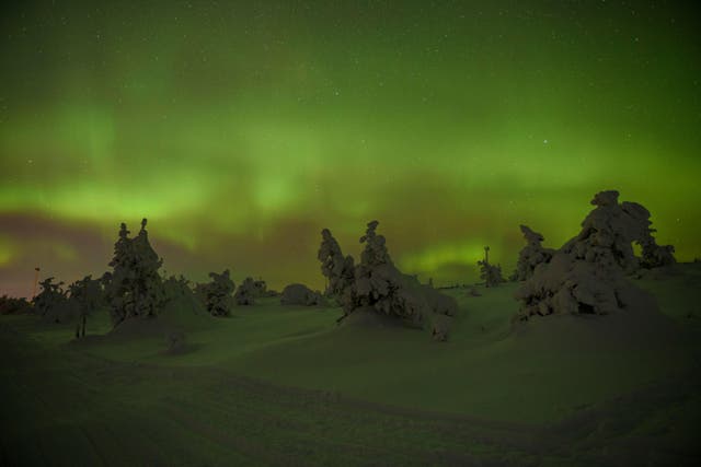 <p>Northern lights over Levi Mountain and ski resort (Alamy/PA)</p>