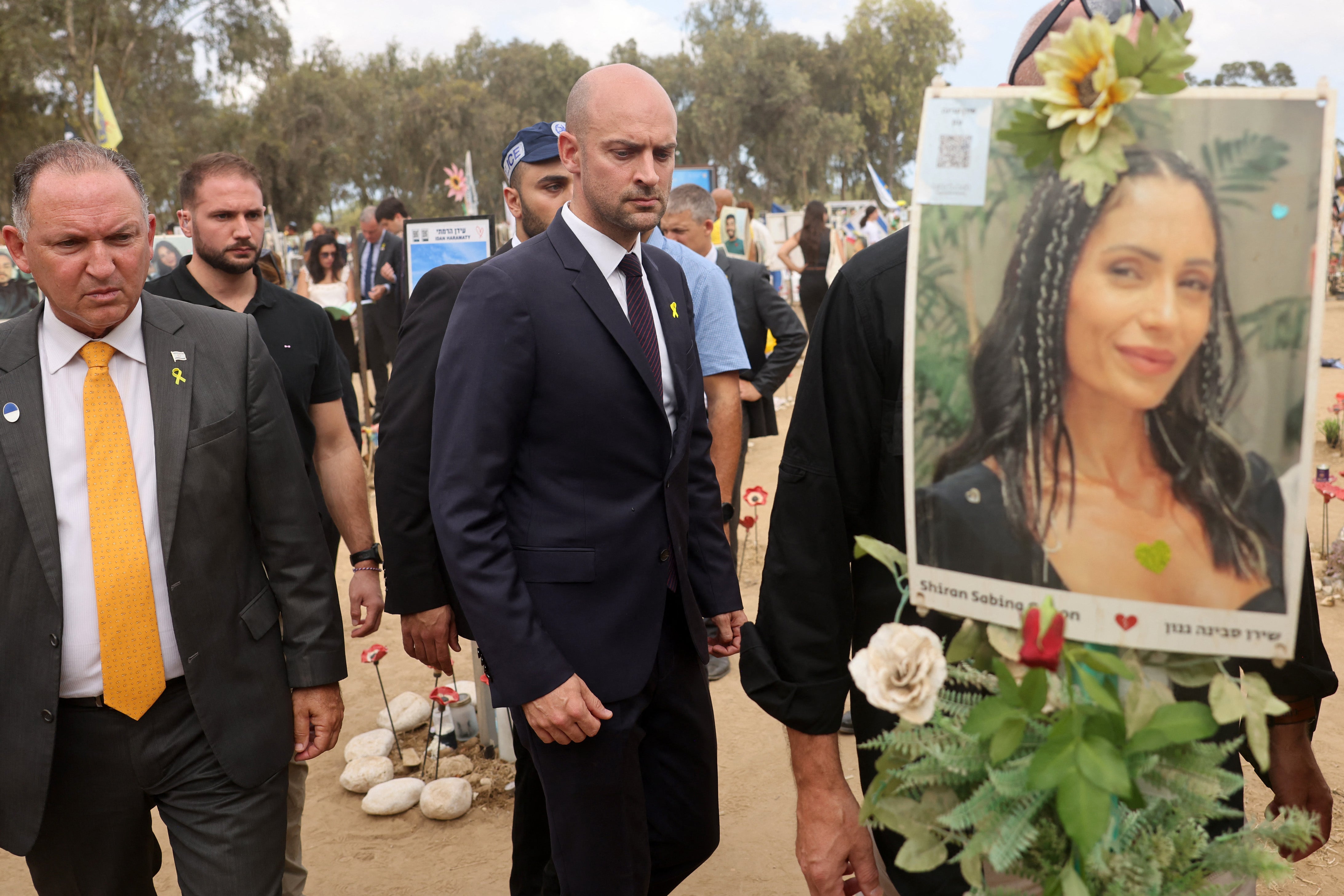 French Minister for Europe and Foreign Affairs Jean-Noel Barrot (C) visits the Nova festival memorial near Kibbutz Reim in southern Israel