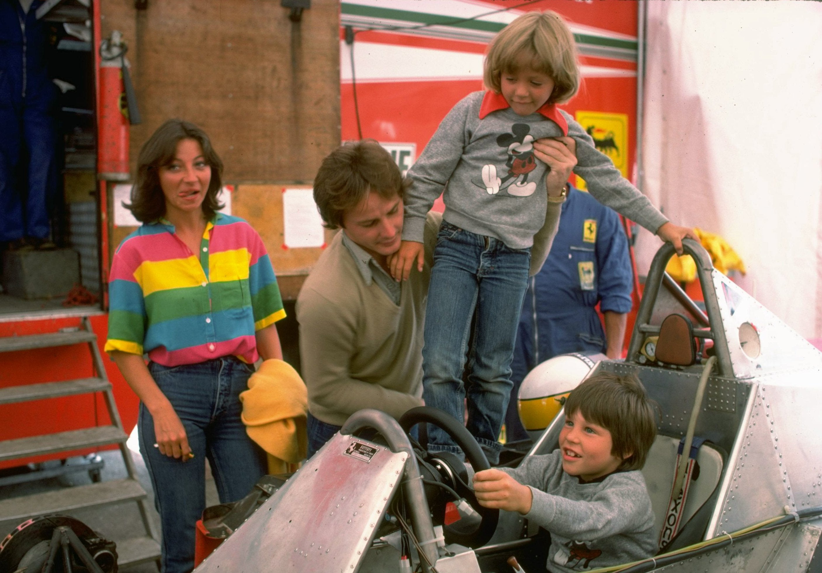 Gilles Villeneuve puts son Jacques in the cockpit of his Ferrari car in 1979