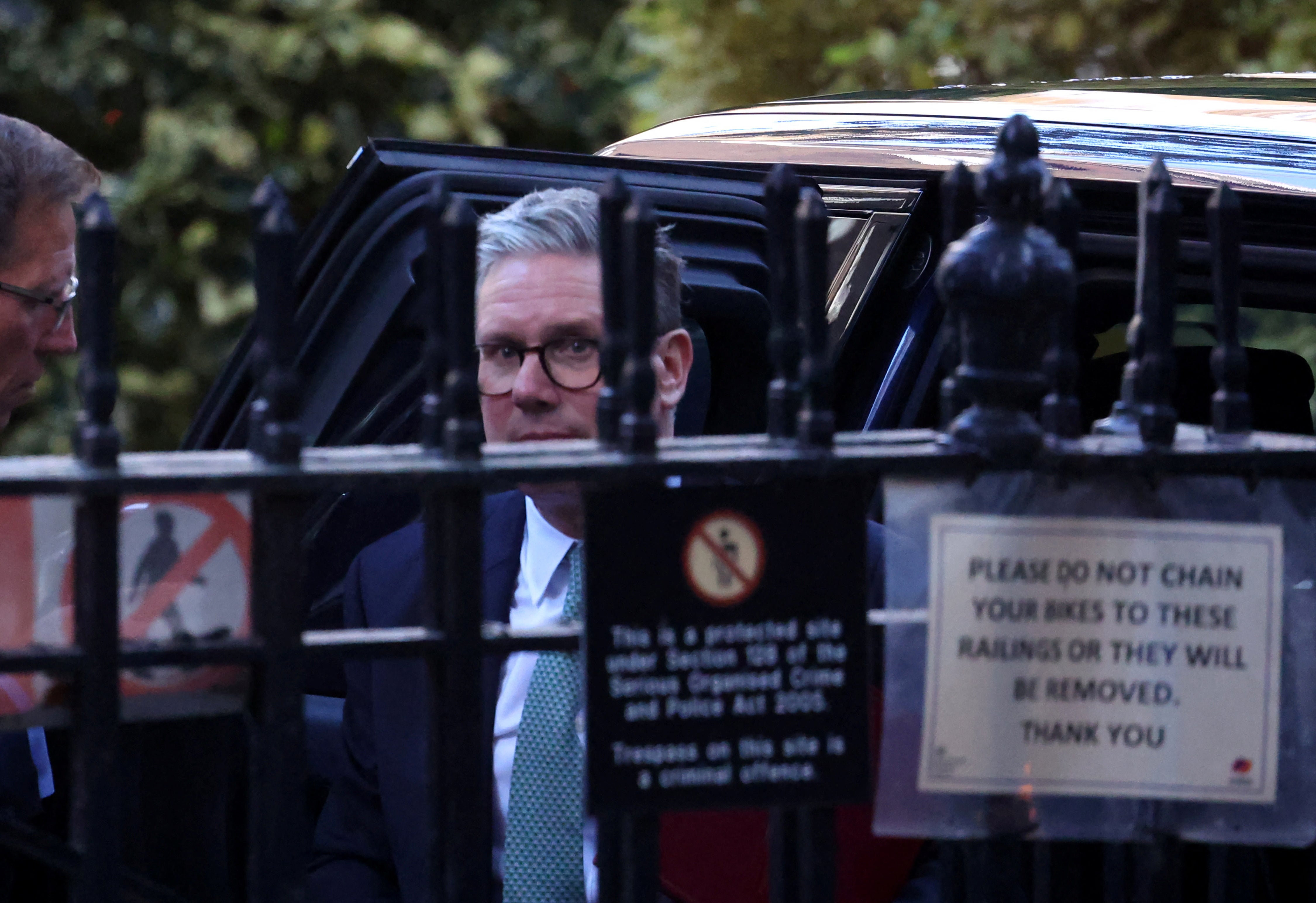 Prime minister Keir Starmer walks into a side entrance of Downing Street