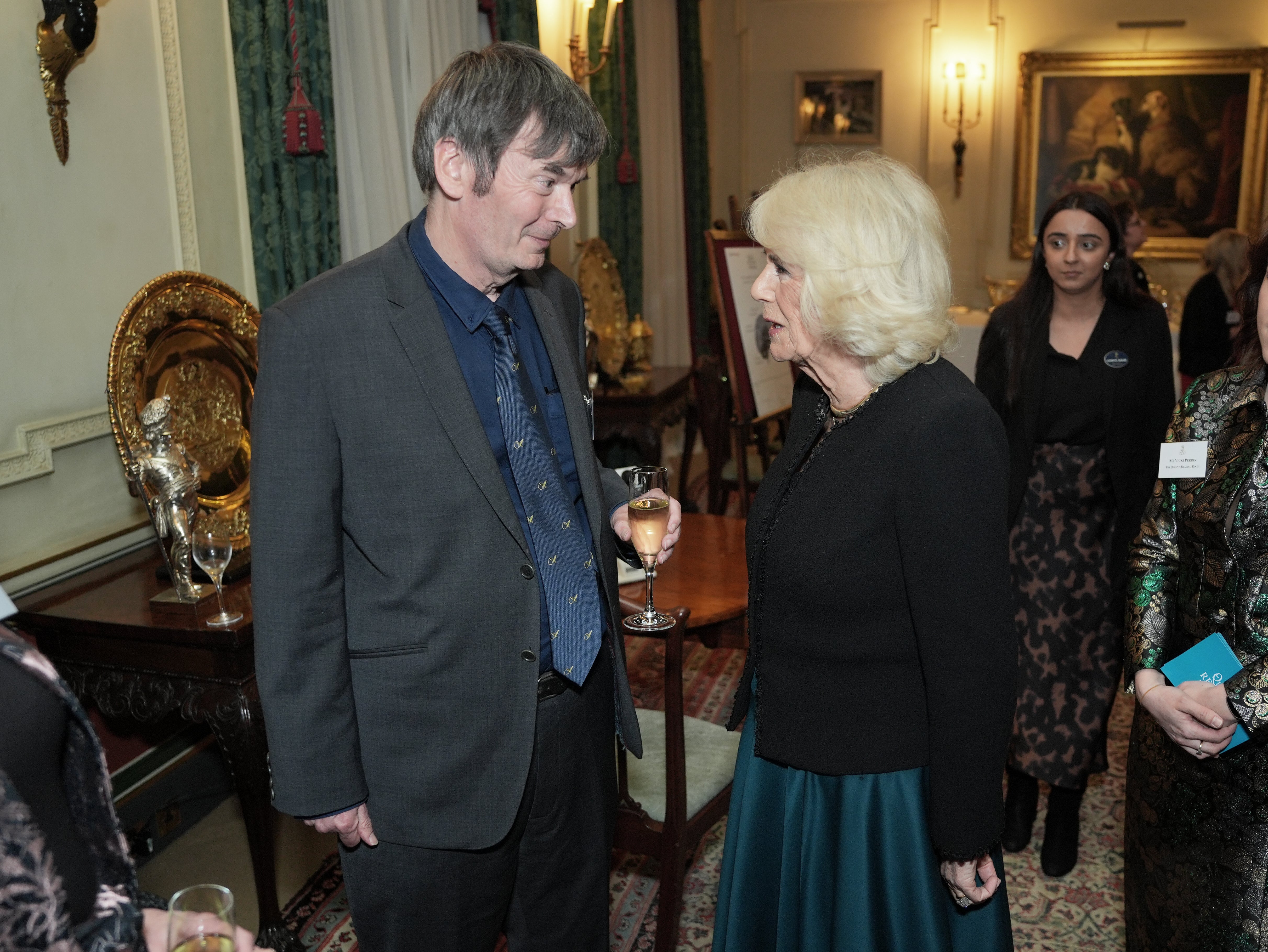 Ian Rankin talking to Queen Camilla at a reception for The Queen’s Reading Room charity, at Clarence House, earlier this year