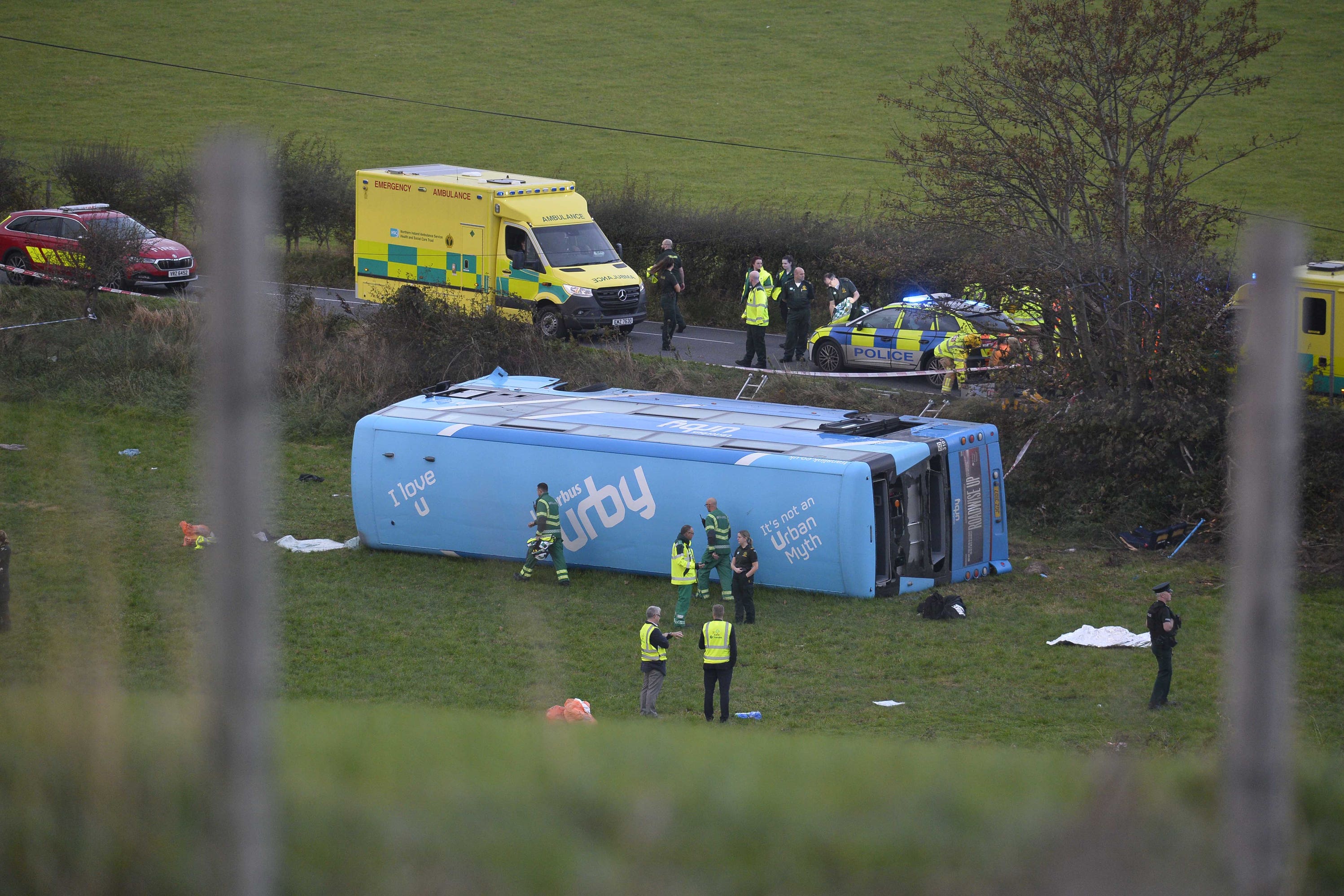 Emergency workers at the scene of a school bus crash on the Ballyblack Road East near Carrowdore in Northern Ireland on Monday afternoon