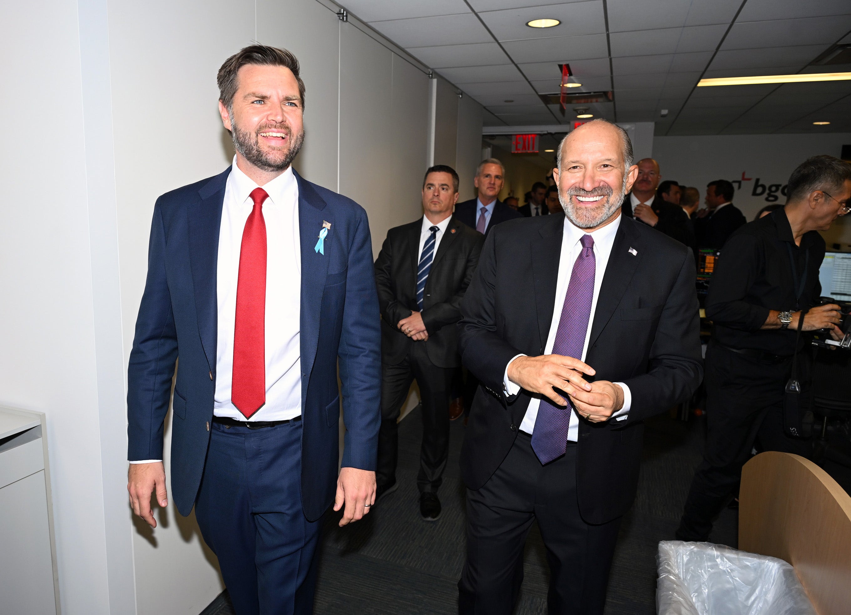 Howard Lutnick, right, is the co-chair of the Trump transition team, and has donated and raised millions of dollars for the campaign.