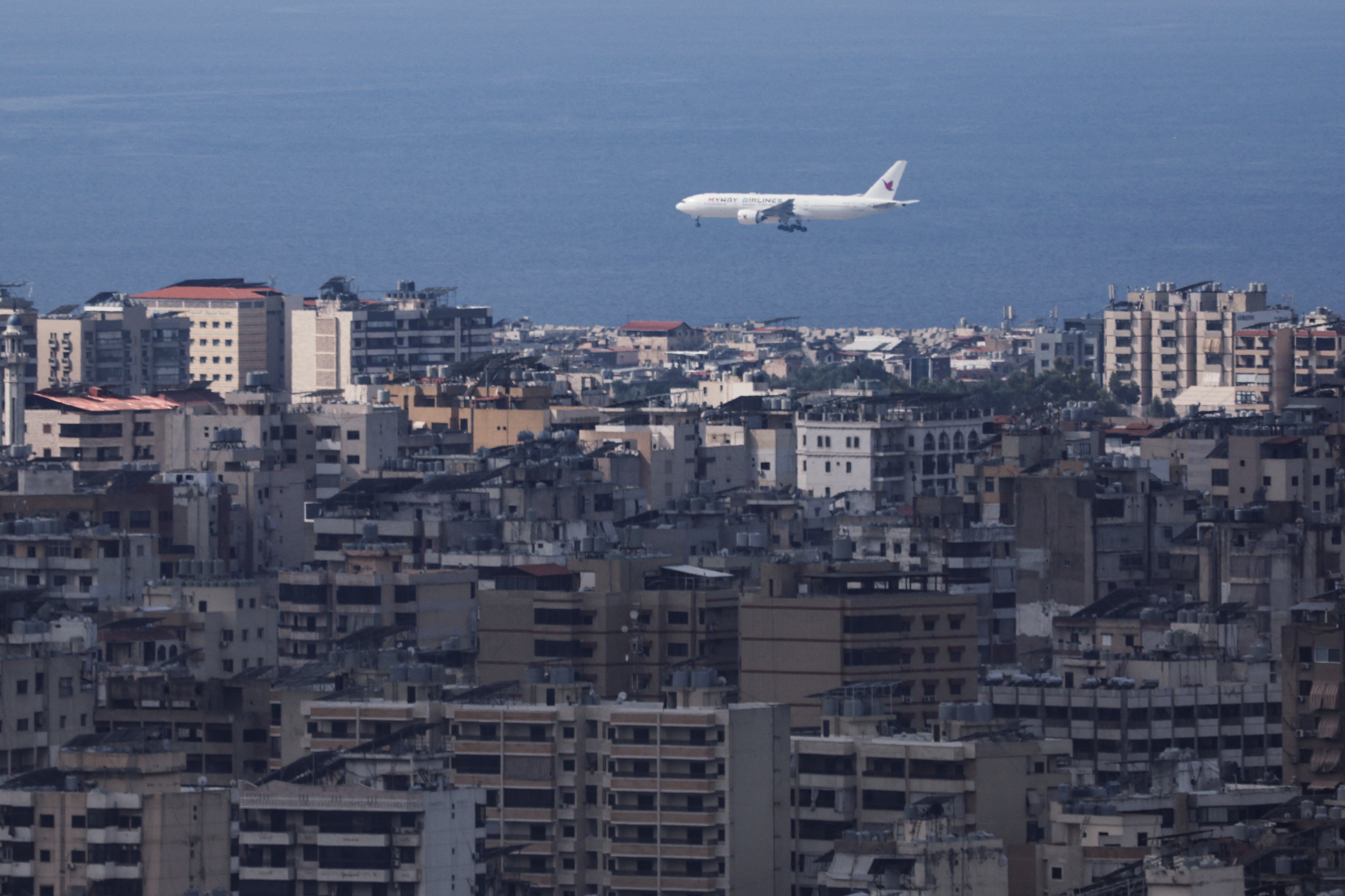 Smoke rises over Dahiyeh in Beirut’s southern suburbs, as seen from Sin El Fil