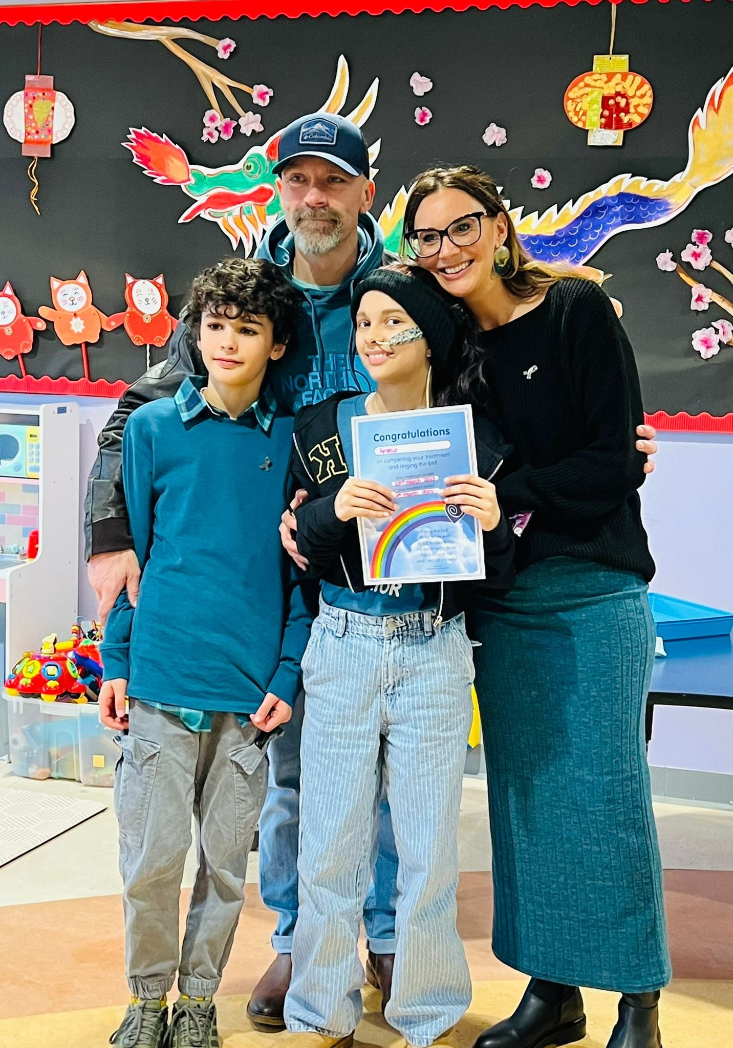 Amelie pictured with her family having finished her treatment