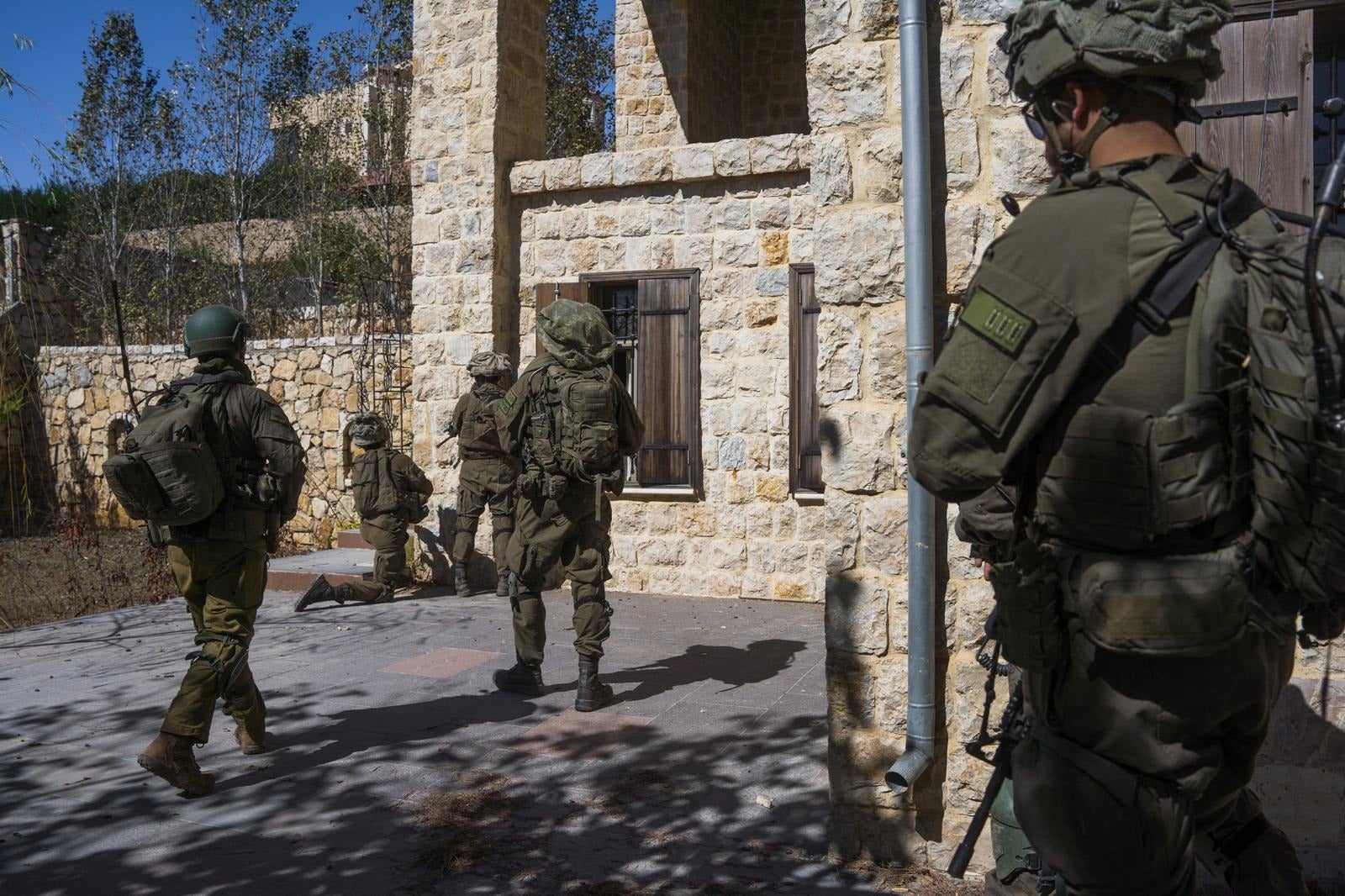 Israel released photos of its troops at a Hezbollah compound just north of the border