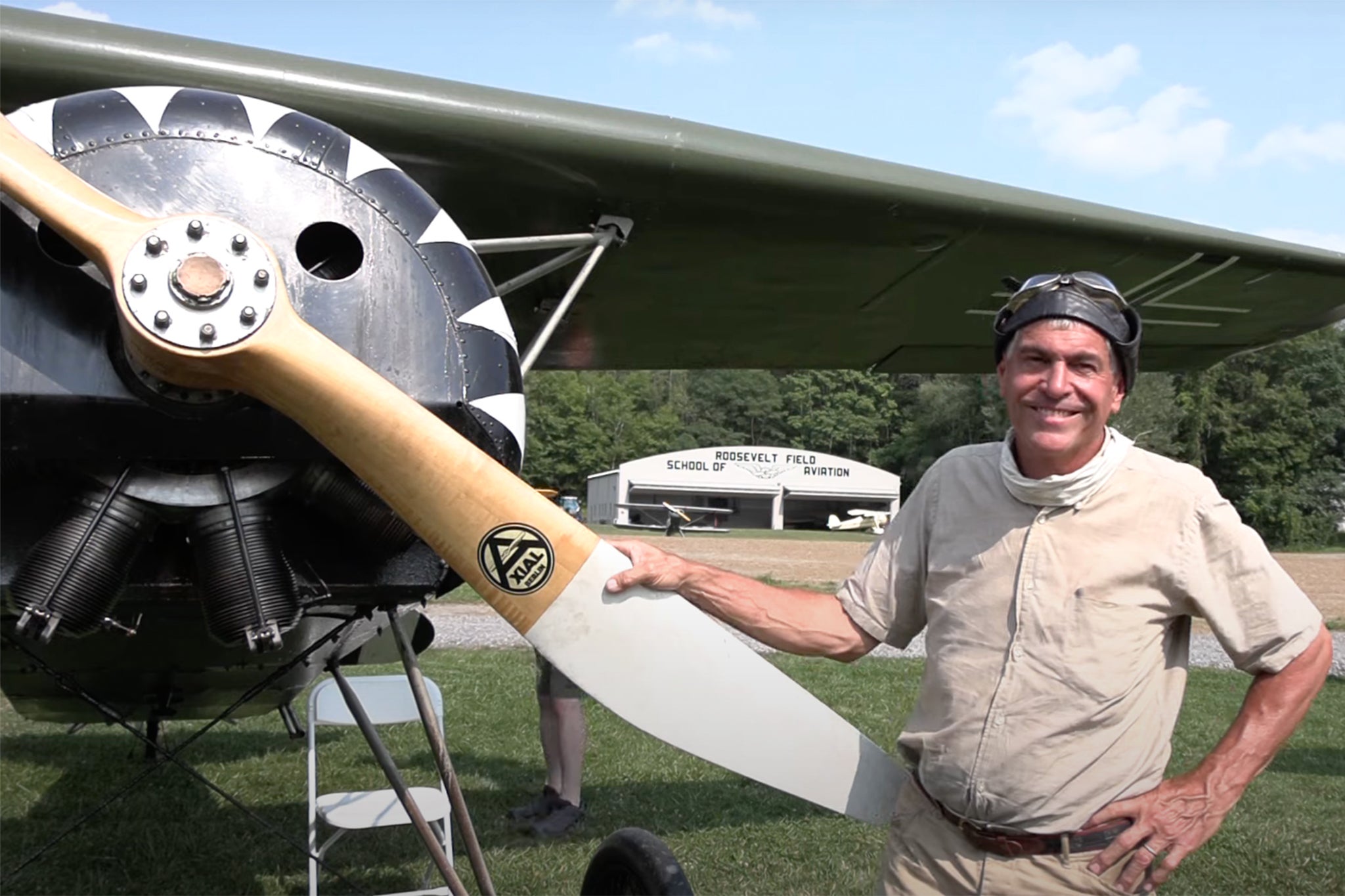 Pictured: Brian Coughlin,60, standing with the Fokker DVIII replica aircraft