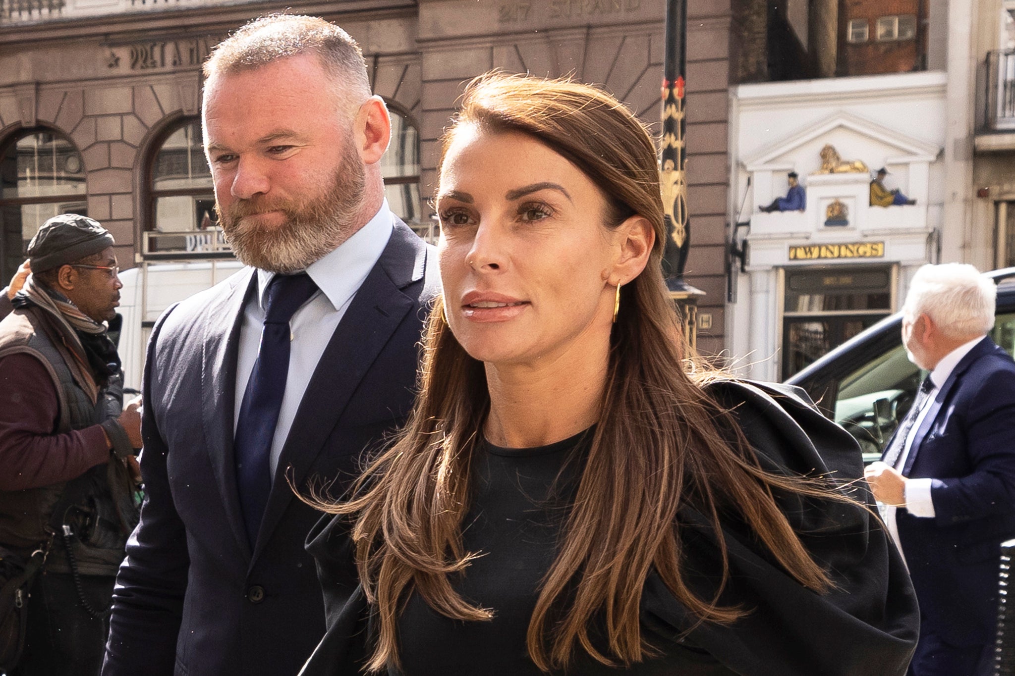 Coleen Rooney arrives with husband Wayne Rooney at Royal Courts of Justice, Strand on May 12, 2022 in London