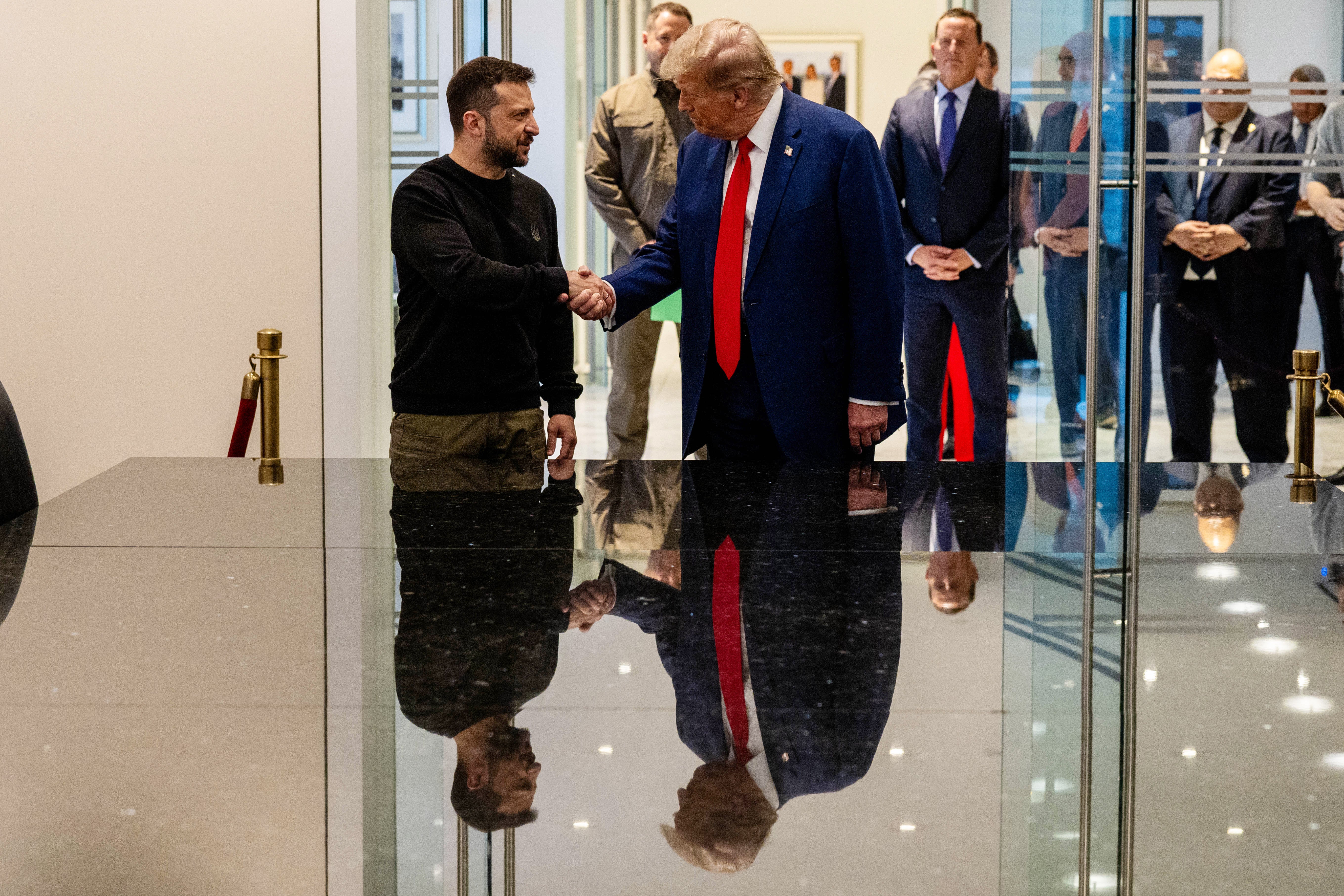 Ukrainian President Volodymyr Zelensky and Donald Trump shake hands during a meeting in New York City on September 27