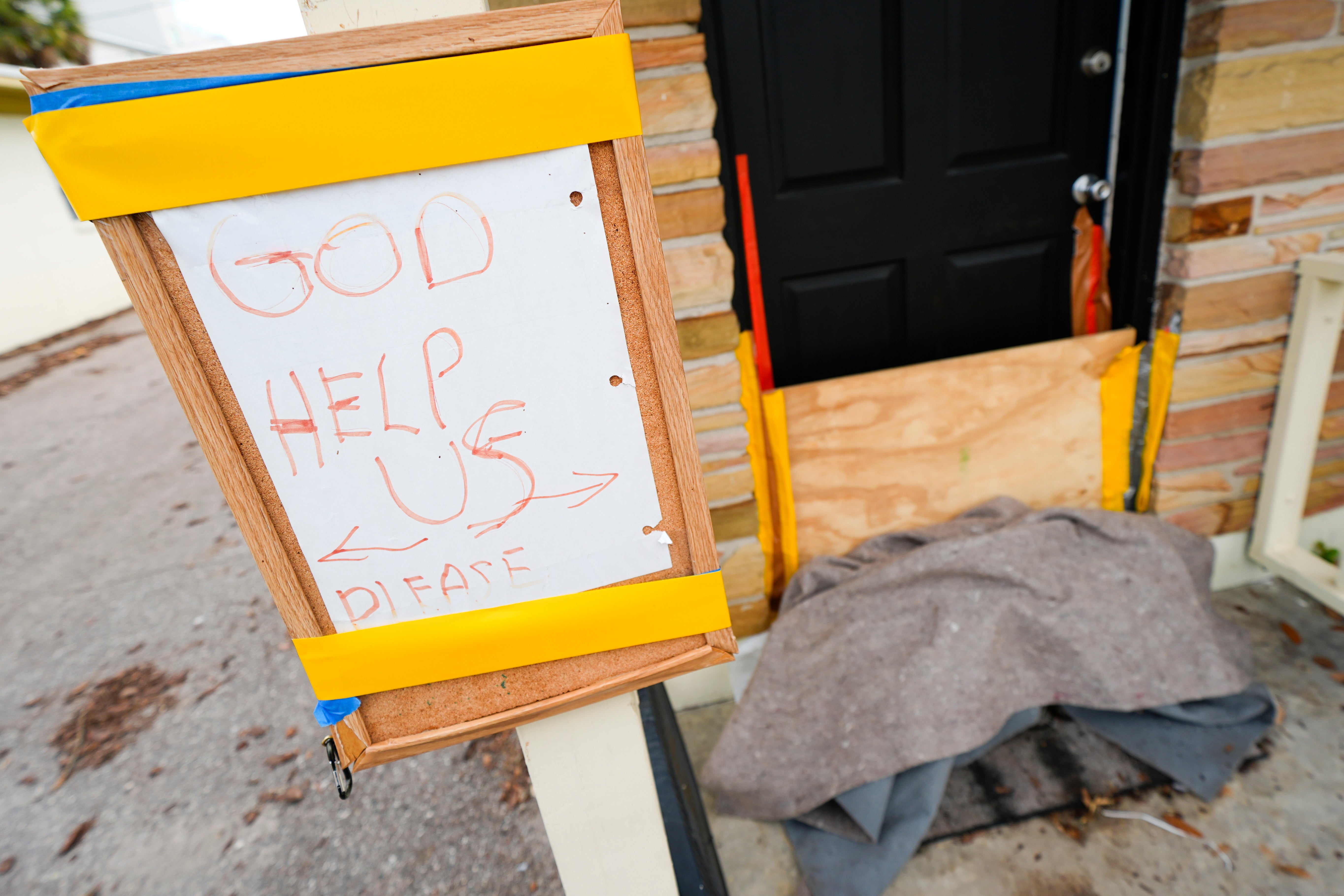 A message is seen outside of an apartment in the Davis Islands community of Tampa, Florida, as residents prepare for the arrival of Hurricane Milton, Tuesday, October 8, 2024