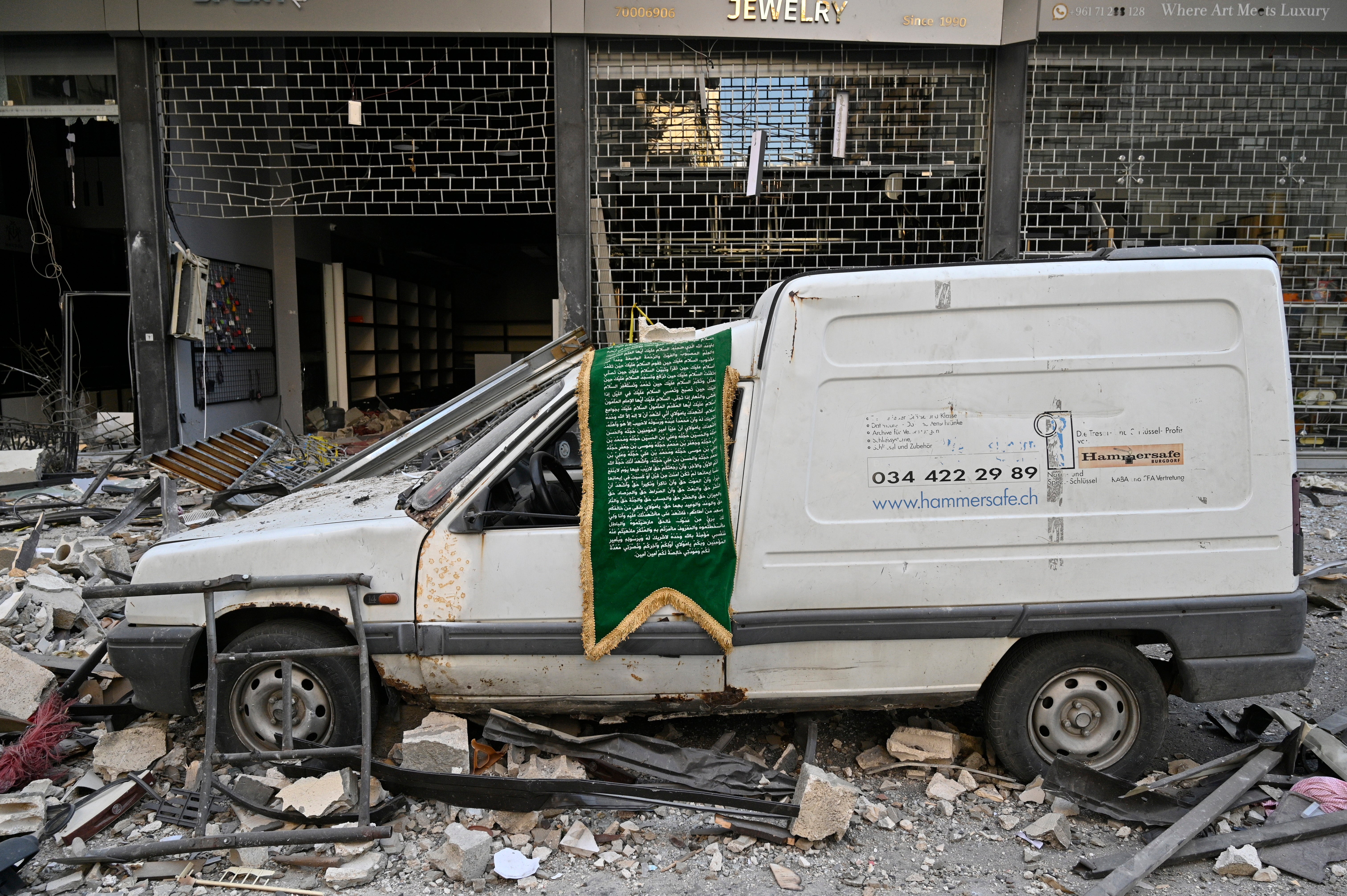 A van sits amid rubble following an overnight Israeli airstrike on Beirut