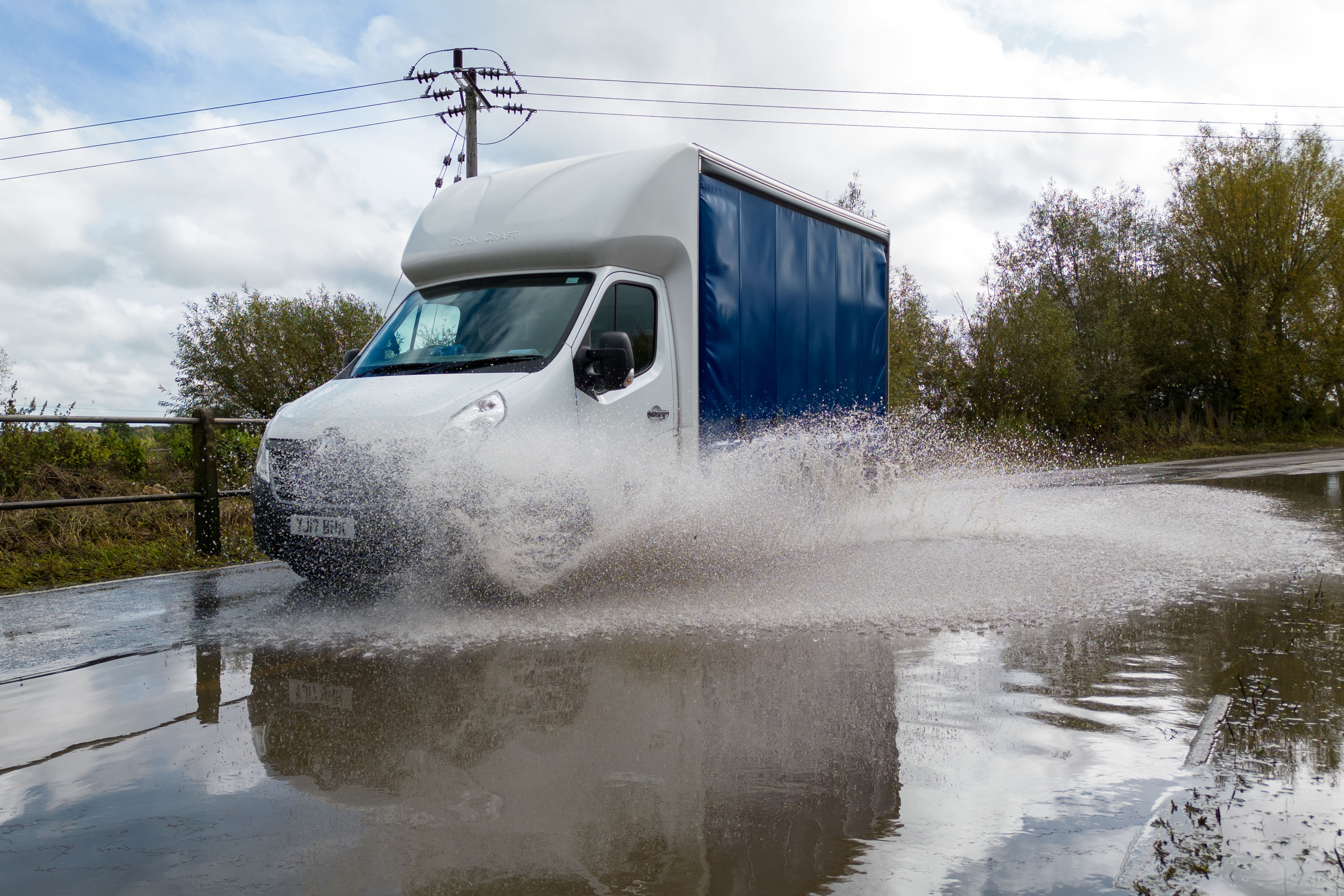 A van on a partially flooded road near Mountsorrel in Leicestershire (Joe Giddens/PA)