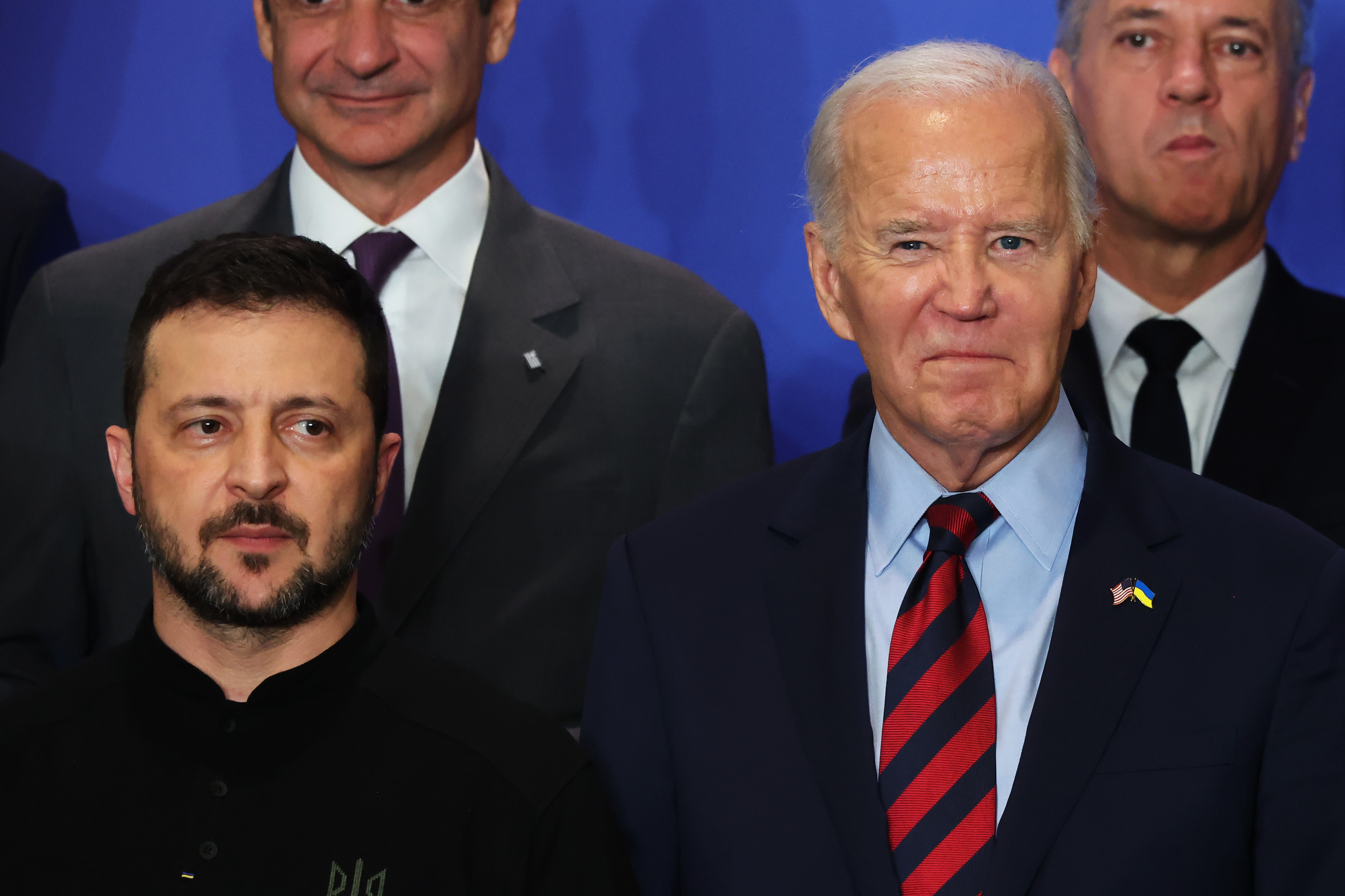 Volodymyr Zelensky and Joe Biden pose for photos on stage during an event with world leaders n New York City