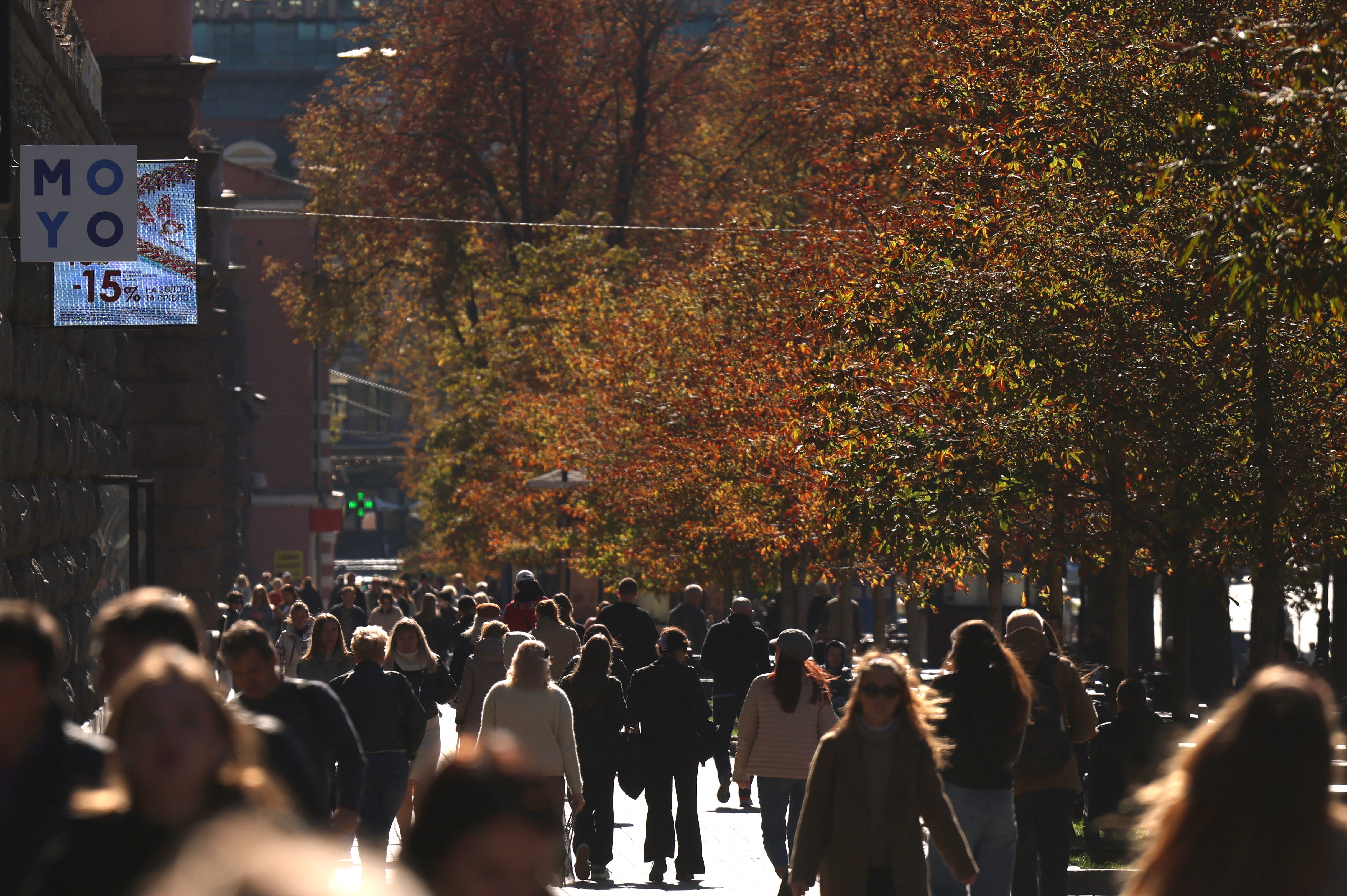 Locals go about their daily lives in central Kyiv