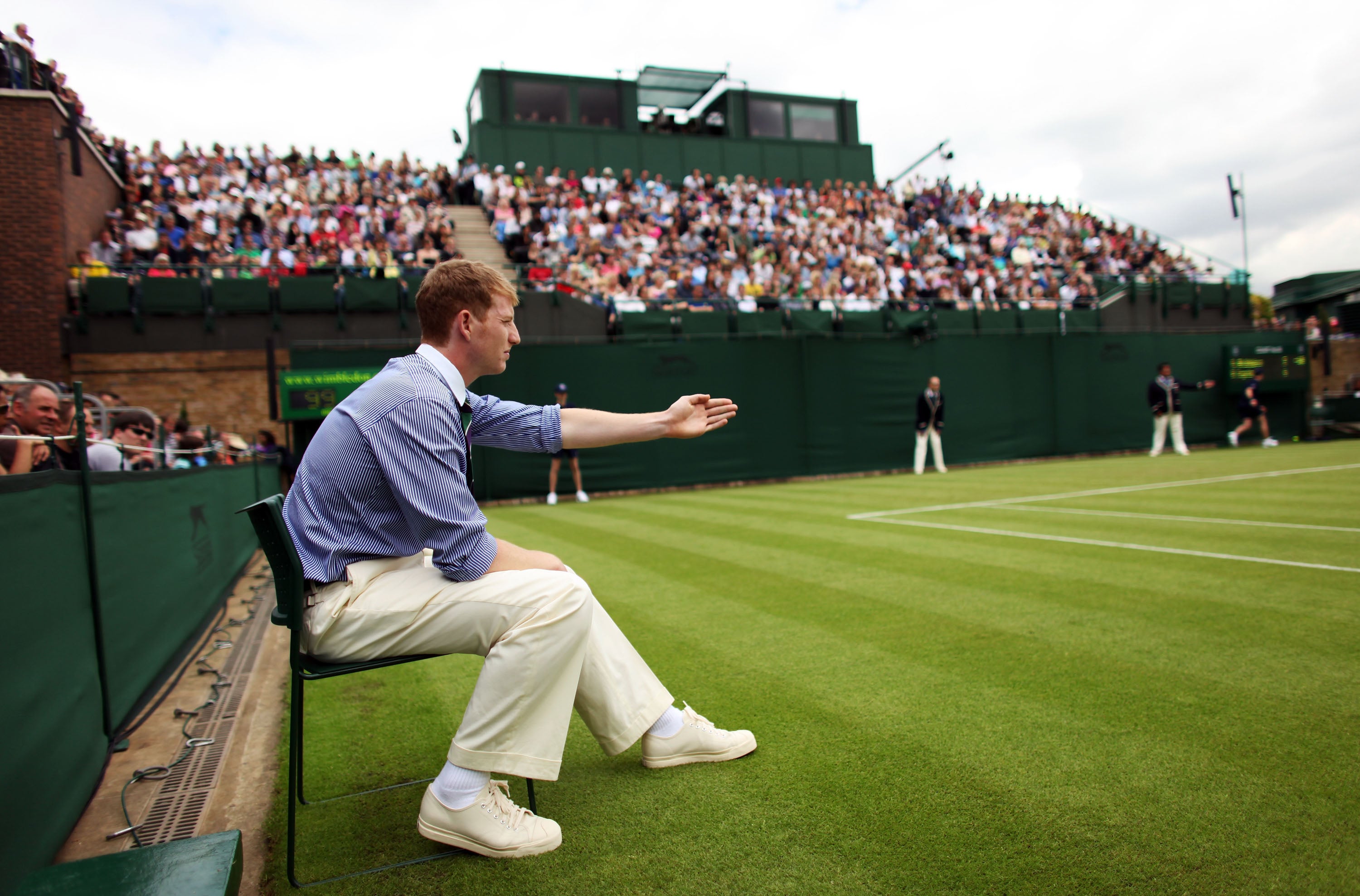 A line judge makes a decision on court 18 at Wimbledon