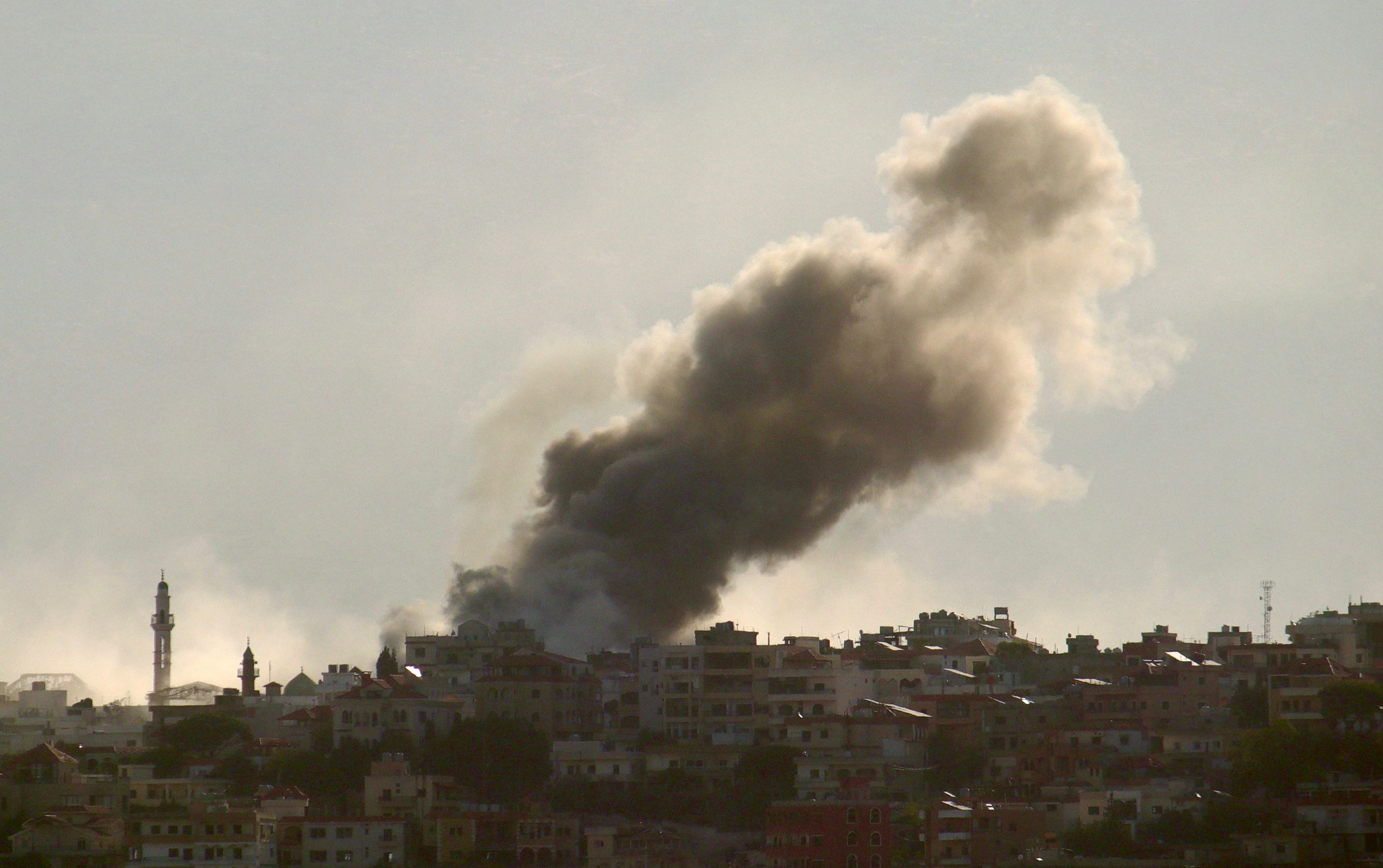 Smoke rises above the Lebanese town of Khiam in the south east of the country following Israeli airstrikes