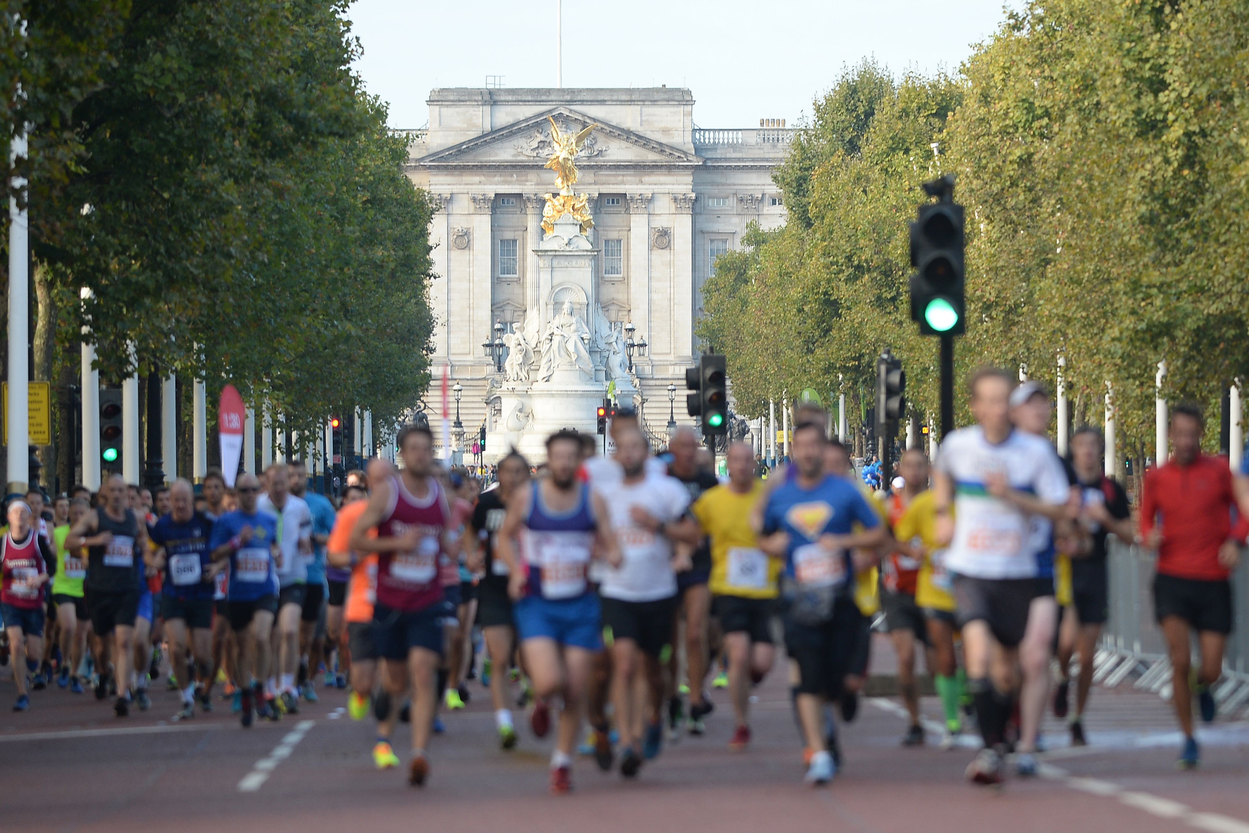 People run along The Mall as they take part in the Royal Parks Half Marathon (PA)