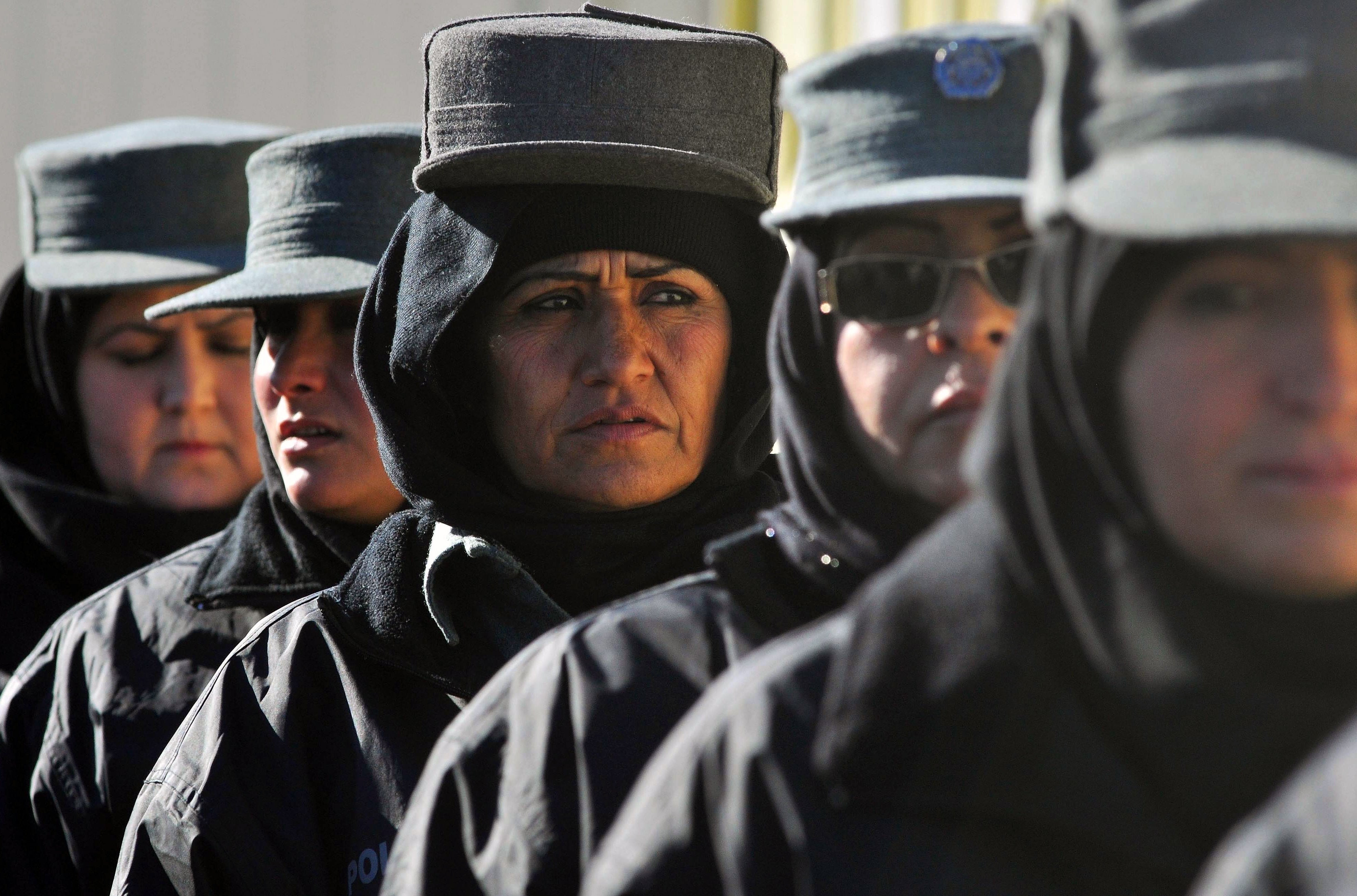 Afghan policewomen stand in formation at a police training centre in Herat in 2011