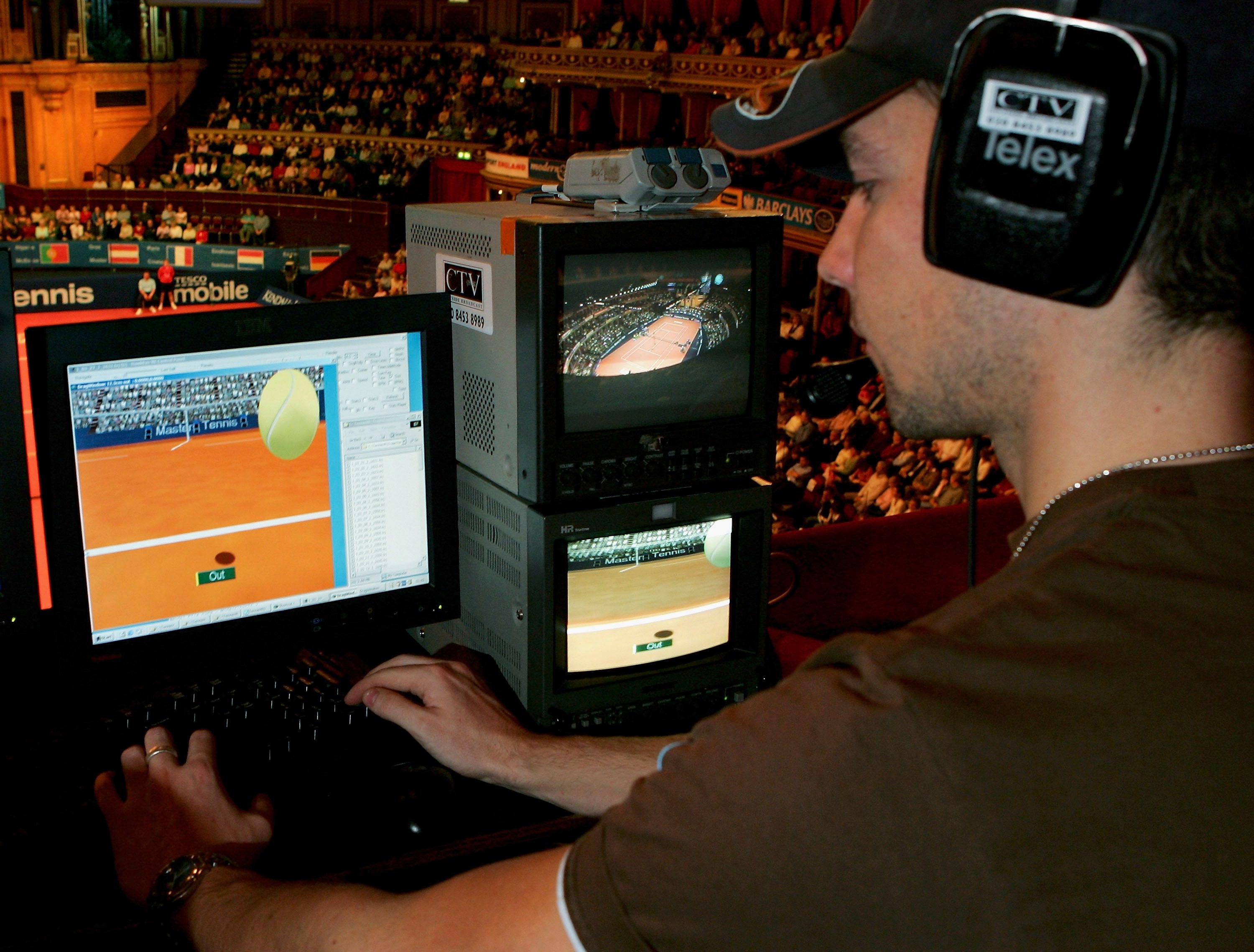 A technician watches screens with the Hawk-Eye system