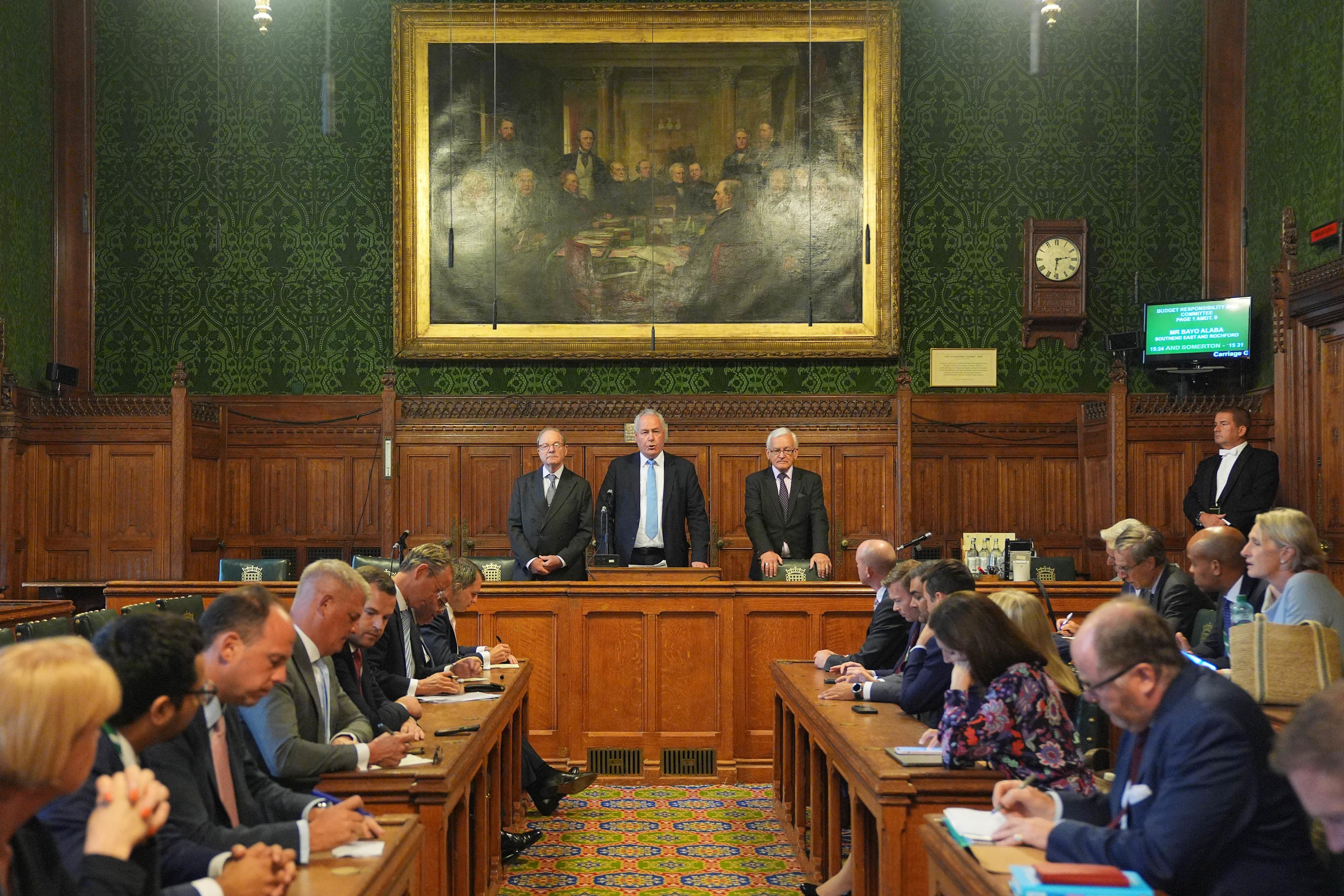 Bob Blackman, chairman of the 1922 Committee, (centre) announces the results of the first ballot round in the Conservative Party leadership contest (PA)