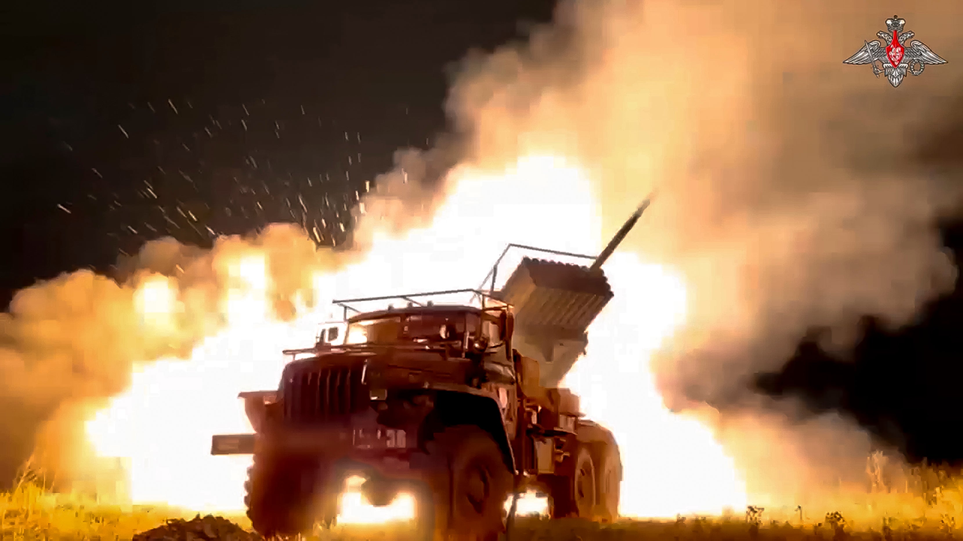 A Russian Army "Grad" self-propelled 122 mm multiple rocket launcher fires rockets toward Ukrainian position at an undisclosed location