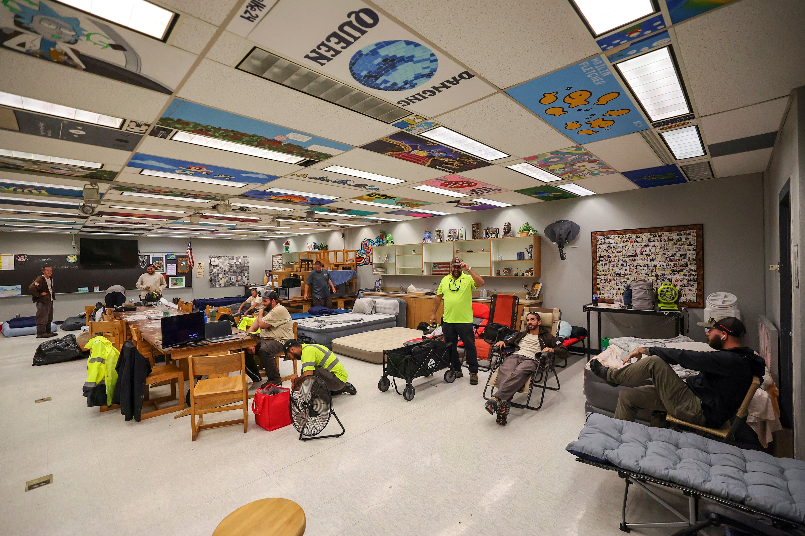 Members of Pasco County utilities set up in classrooms in a hurricane shelter in New Port Richey