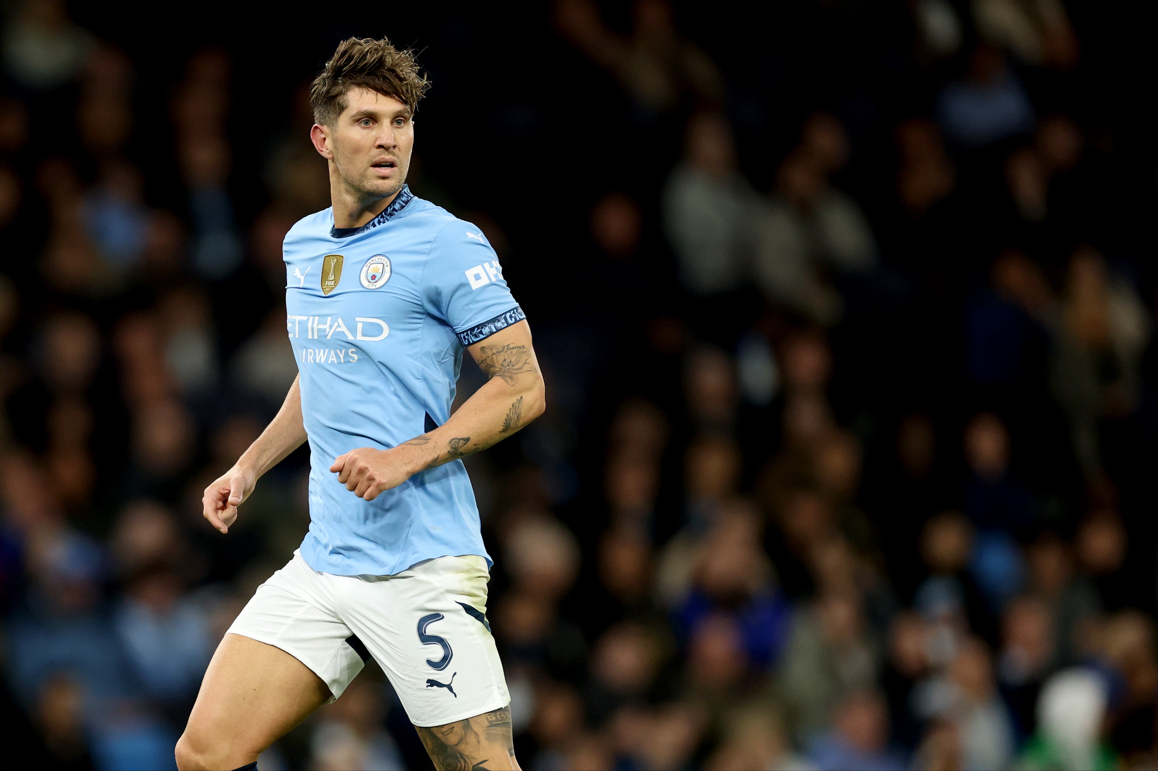 John Stones is not worried about matters off the pitch at Manchester City