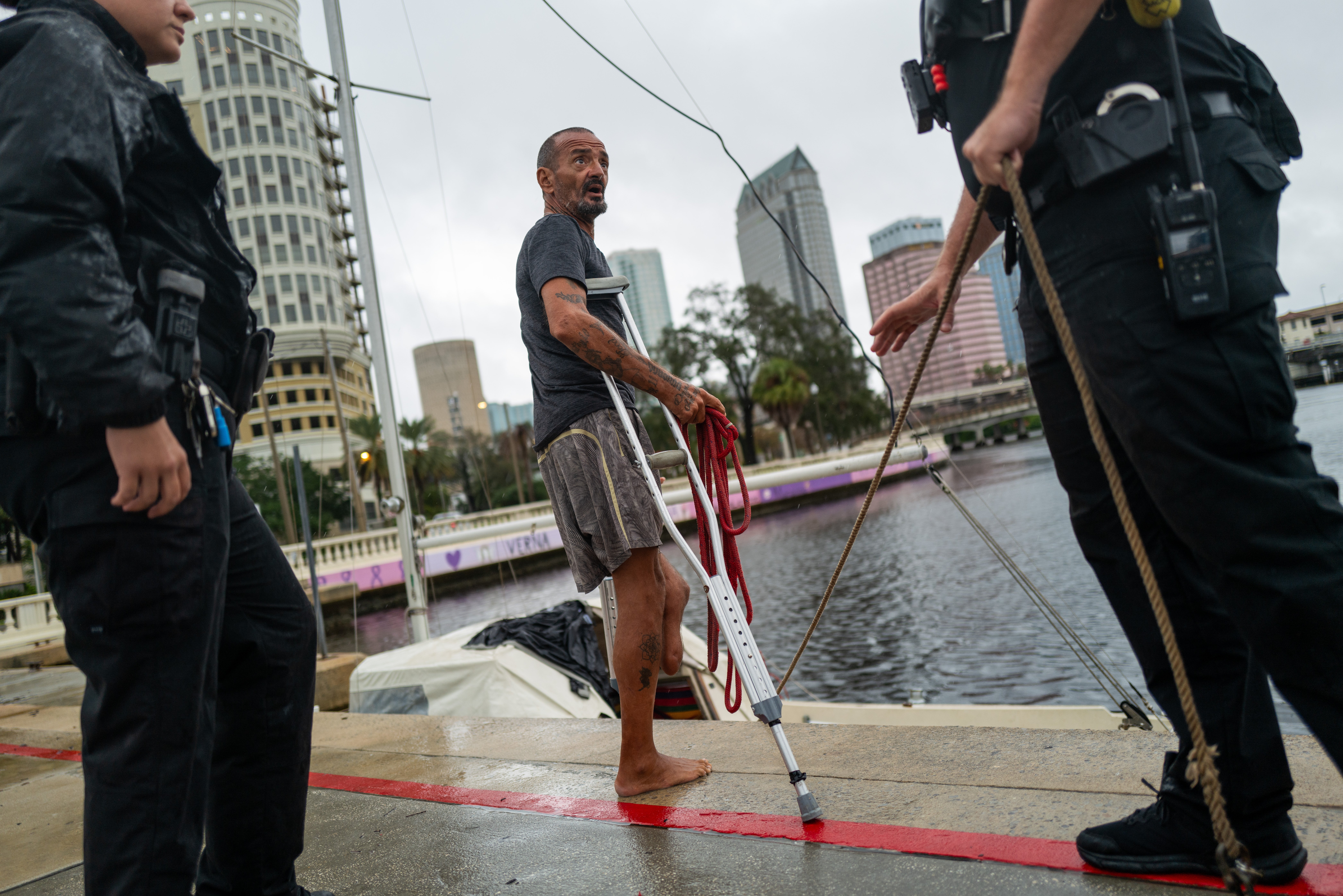 Tampa police try to persuade a local resident who is living on his boat known as Jay and nicknamed ‘Lieutenant Dan’ to leave for his own safety