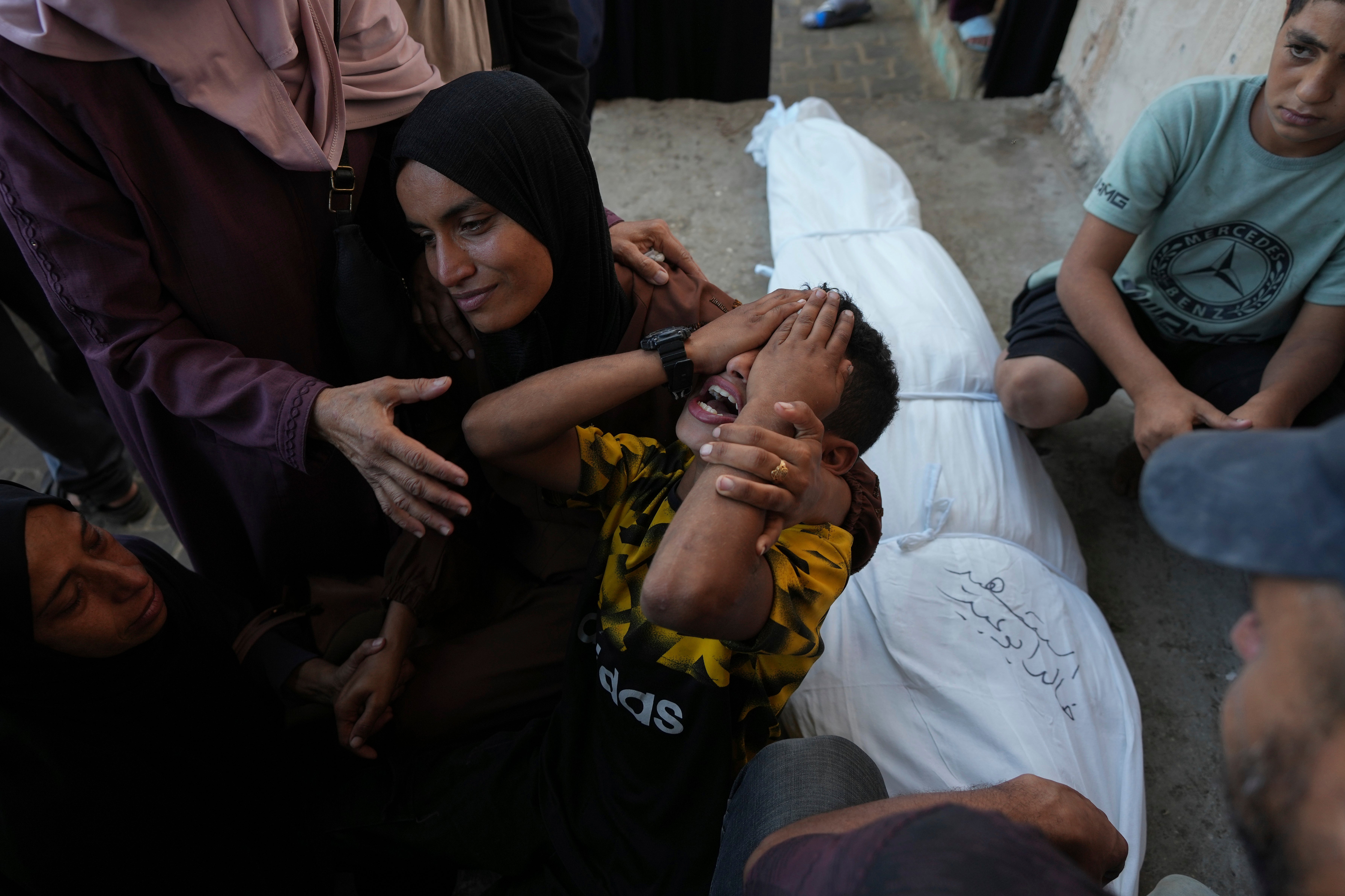 Mourners attend the funeral of Palestinians killed in the Israeli bombardment of the Gaza Strip on Wednesday