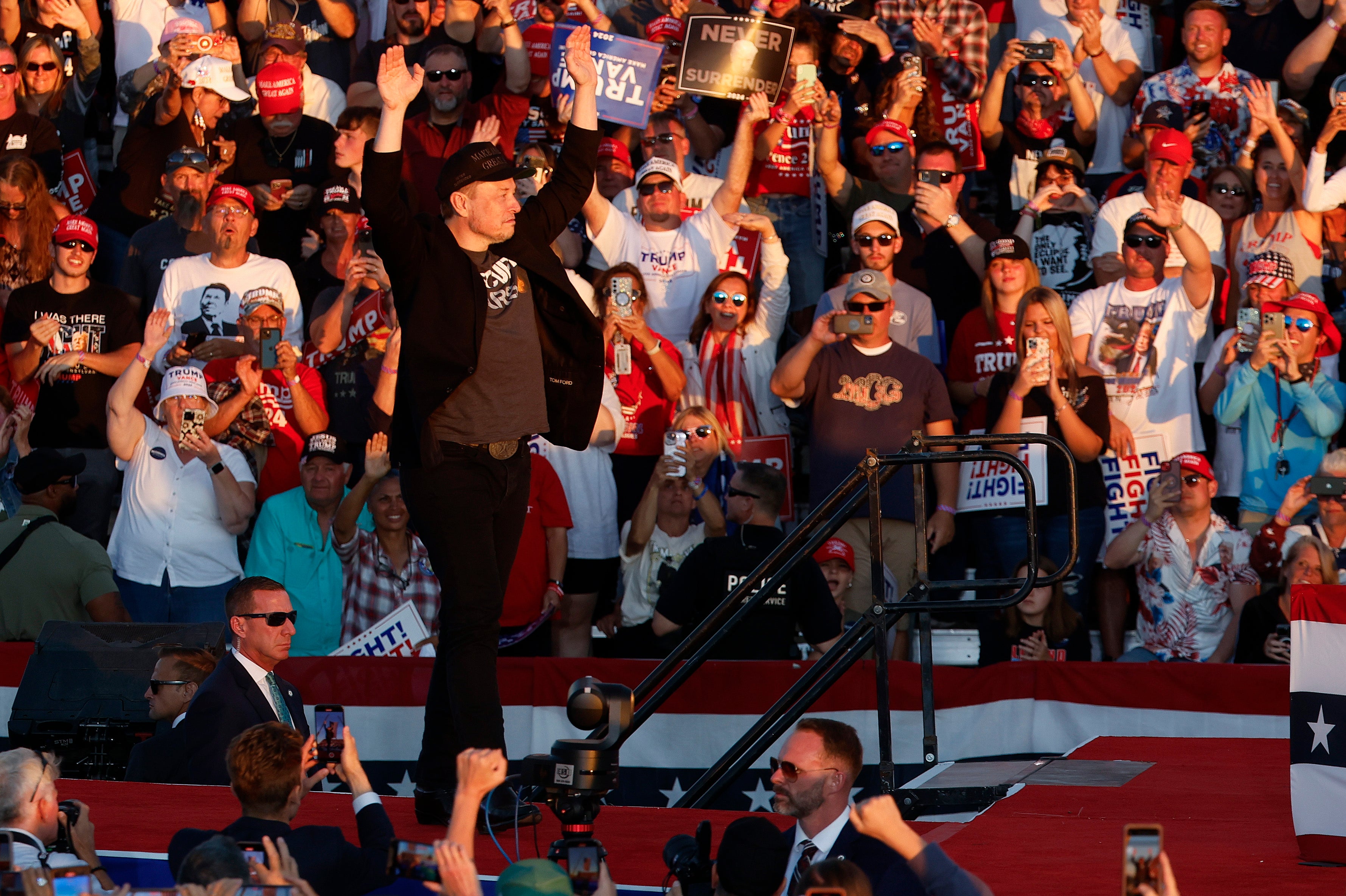 The crowd cheers for Elon Musk at the Trump rally over the weekend