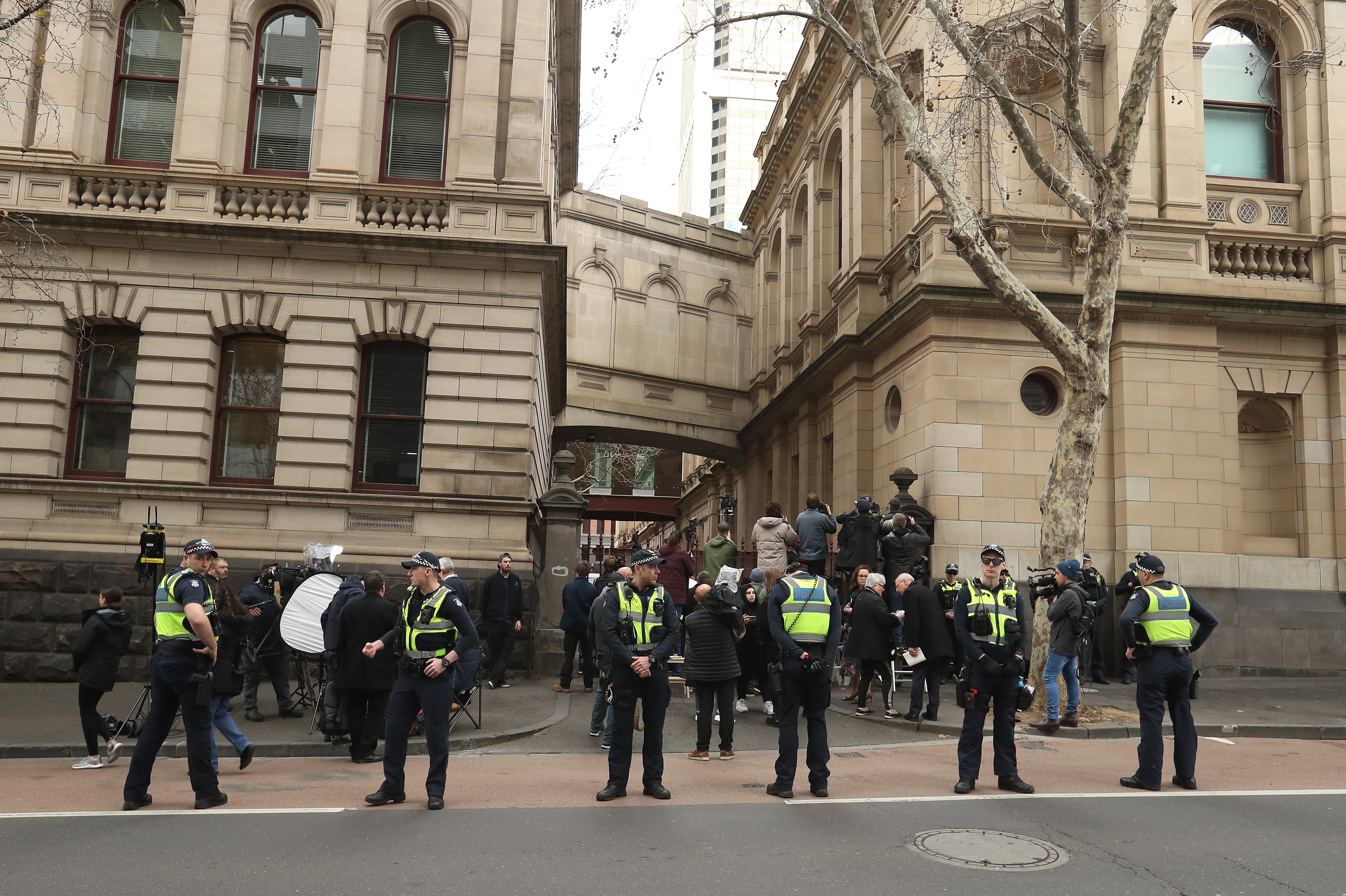 File. Media and police are seen outside the Supreme Court of Victoria