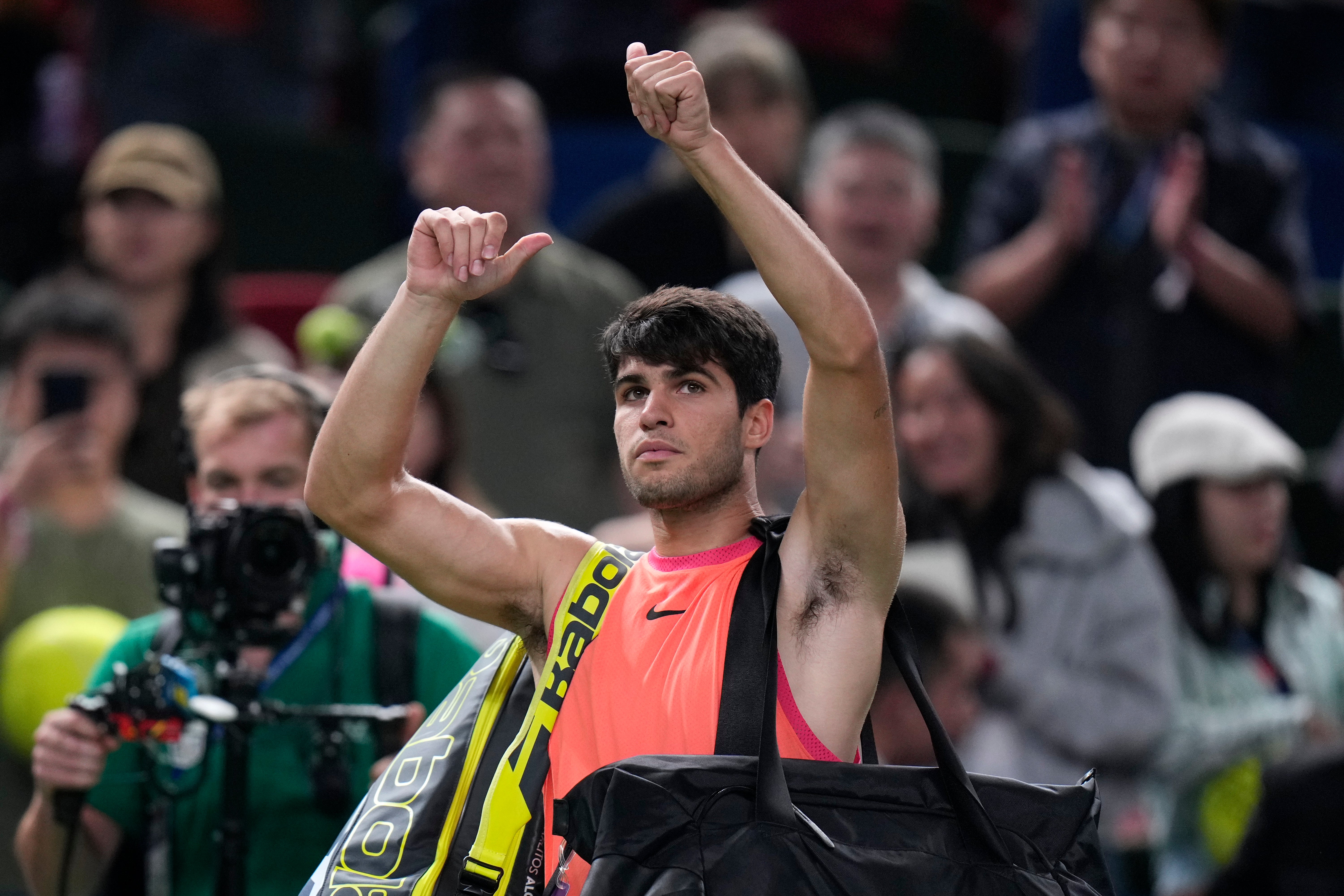 Carlos Alcaraz lost in straight sets, ending a 12-match winning run (Andy Wong/AP)