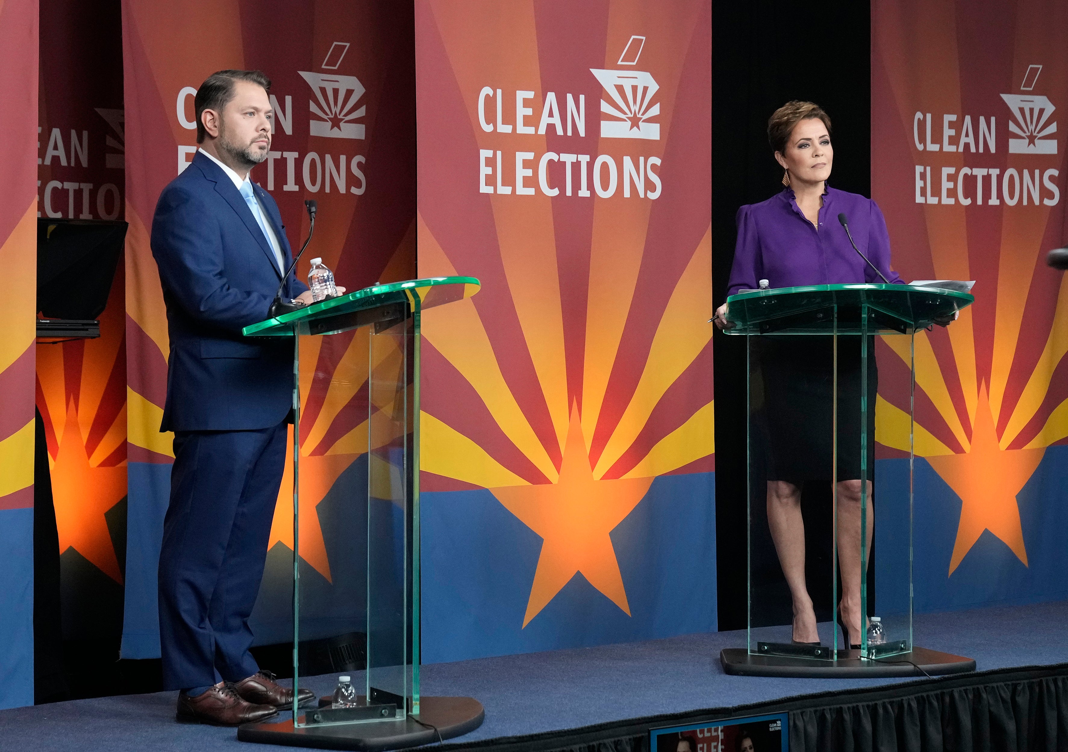 U.S. Senate candidates Rep. Ruben Gallego, D-Ariz., left, and Republican challenger Kari Lake participate in their debate on Oct. 9 in Phoenix