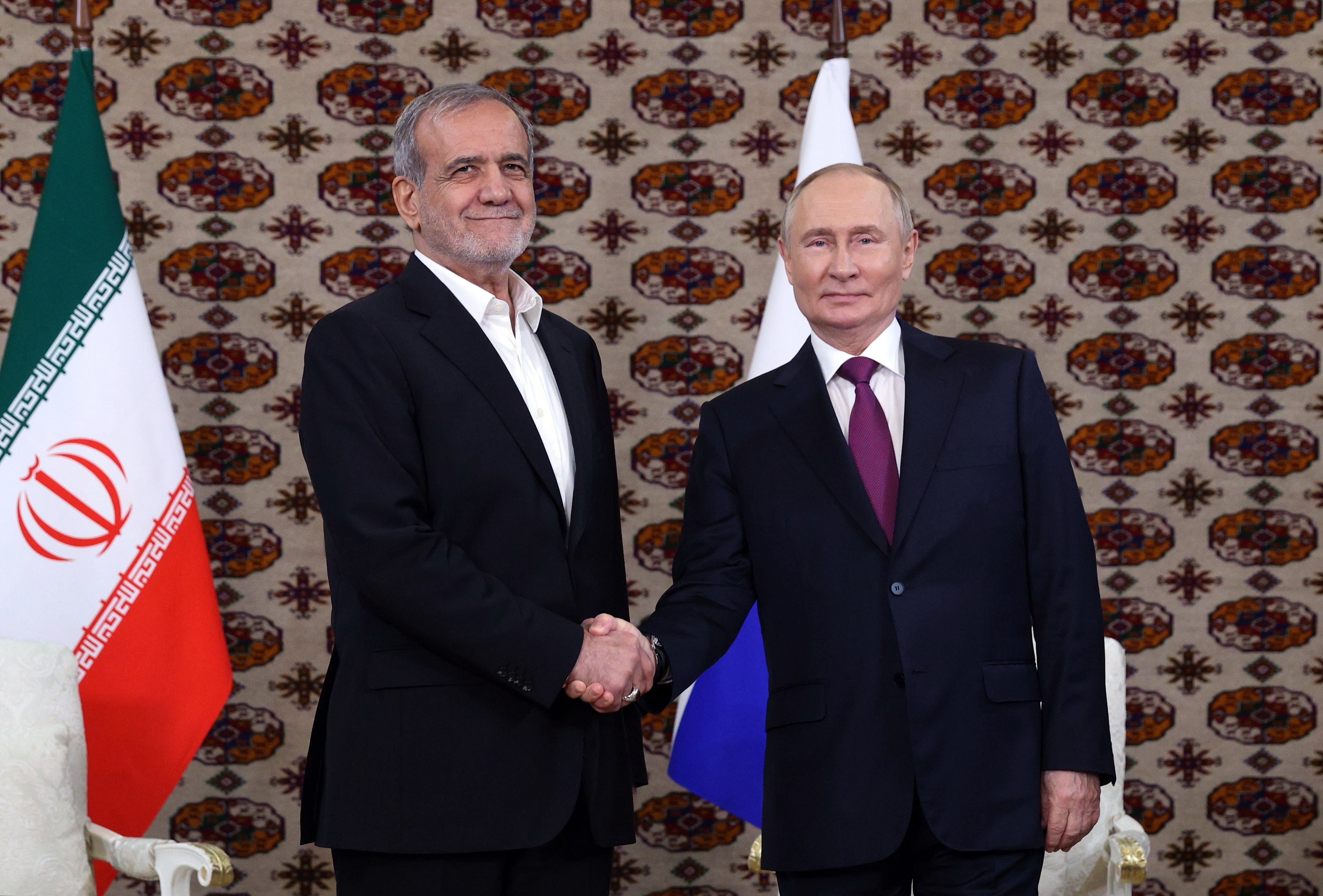 Putin meets with Iranian president Masoud Pezeshkian in Ashgabat, Turkmenistan