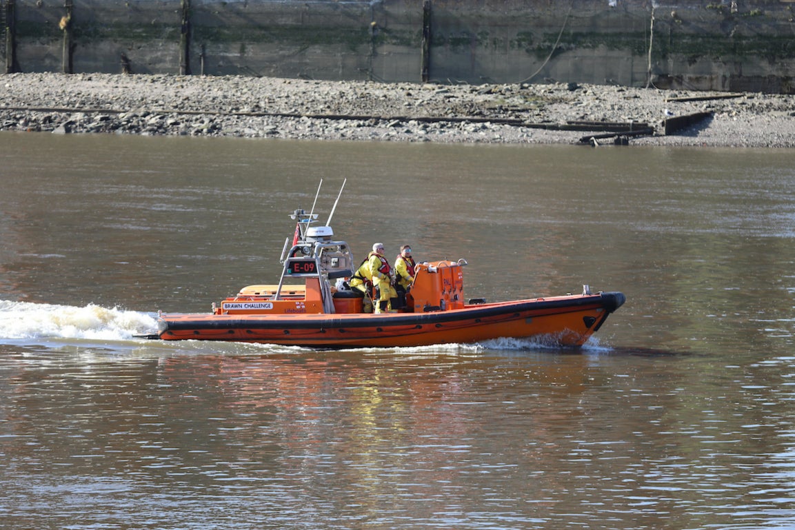 A rowing boat carrying six people capsized in the River Thames on Friday