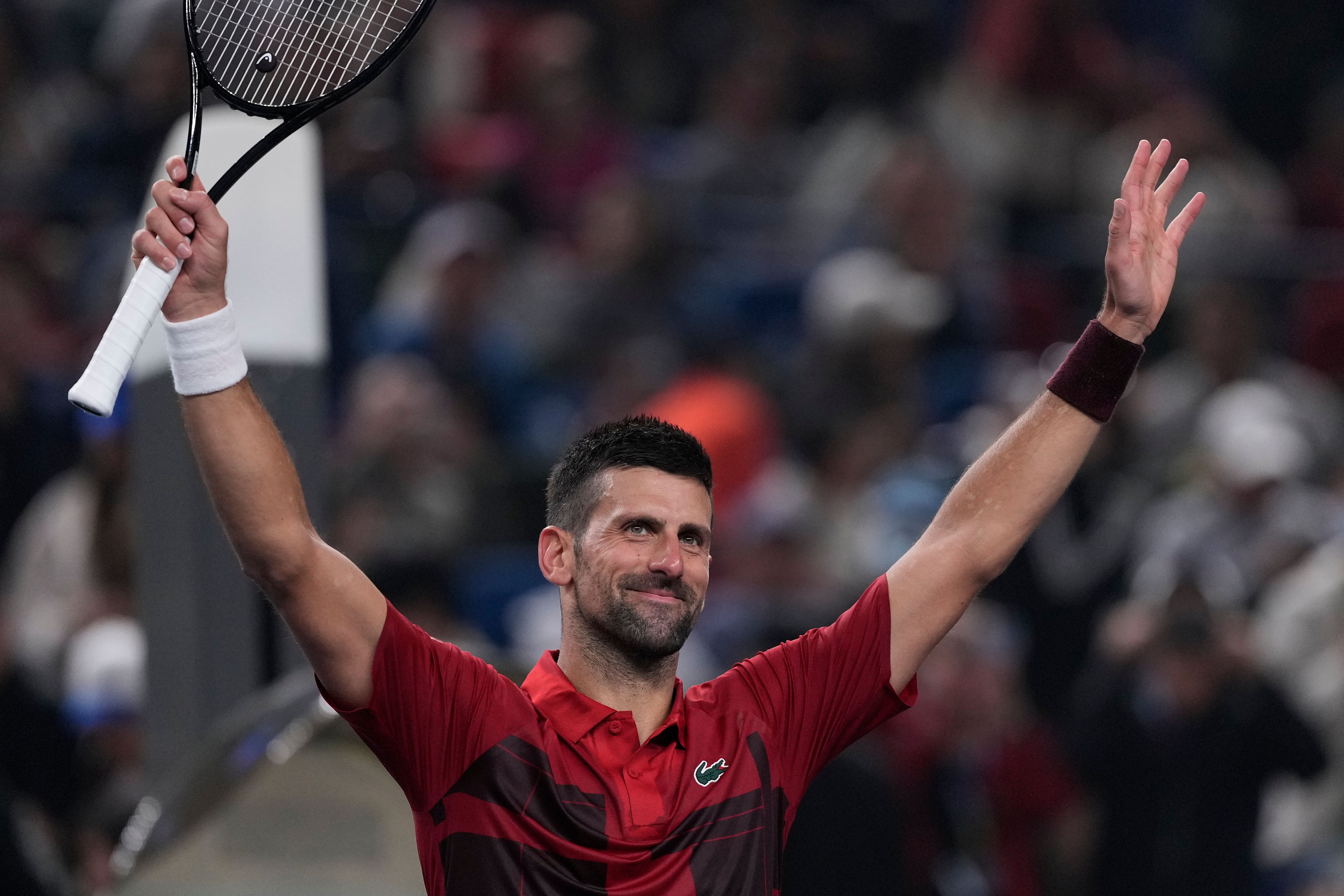 Novak Djokovic celebrates after defeating Jakub Mensik (Andy Wong/AP)