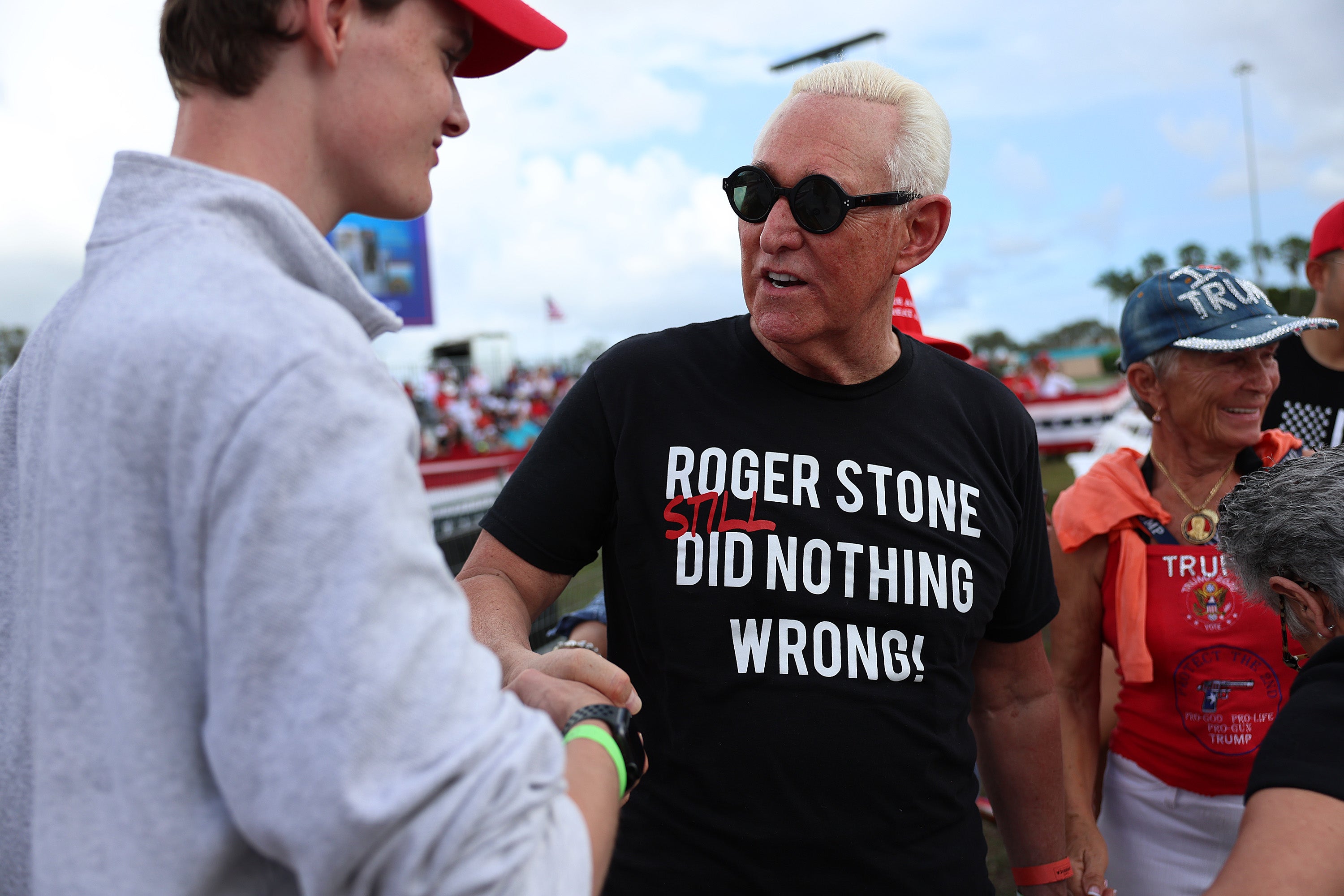 Stone greets people before Trump takes the stage at the Miami-Dade County Fair and Exposition in November 2022