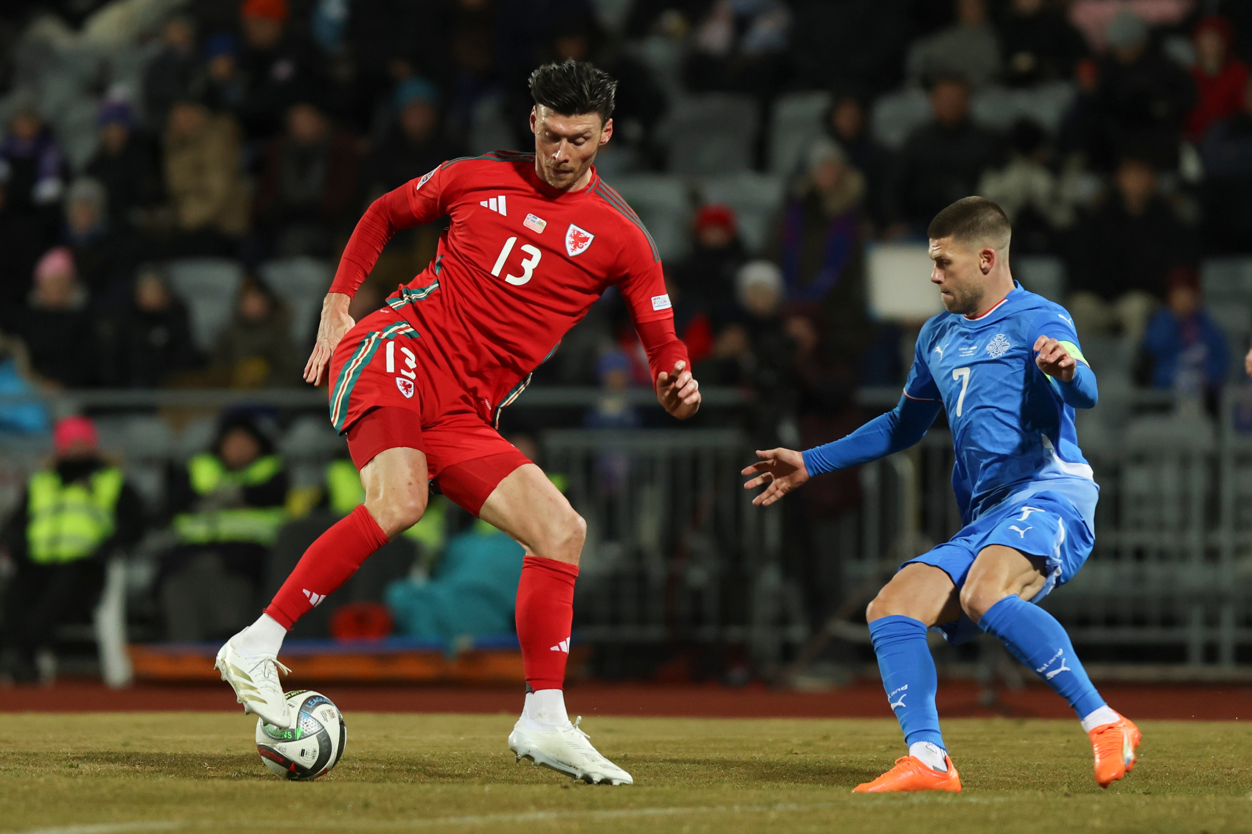 Kieffer Moore controls the ball in front of Iceland’s Johann Berg Gudmundsson in Reykjavik (Arni Torfason/AP)