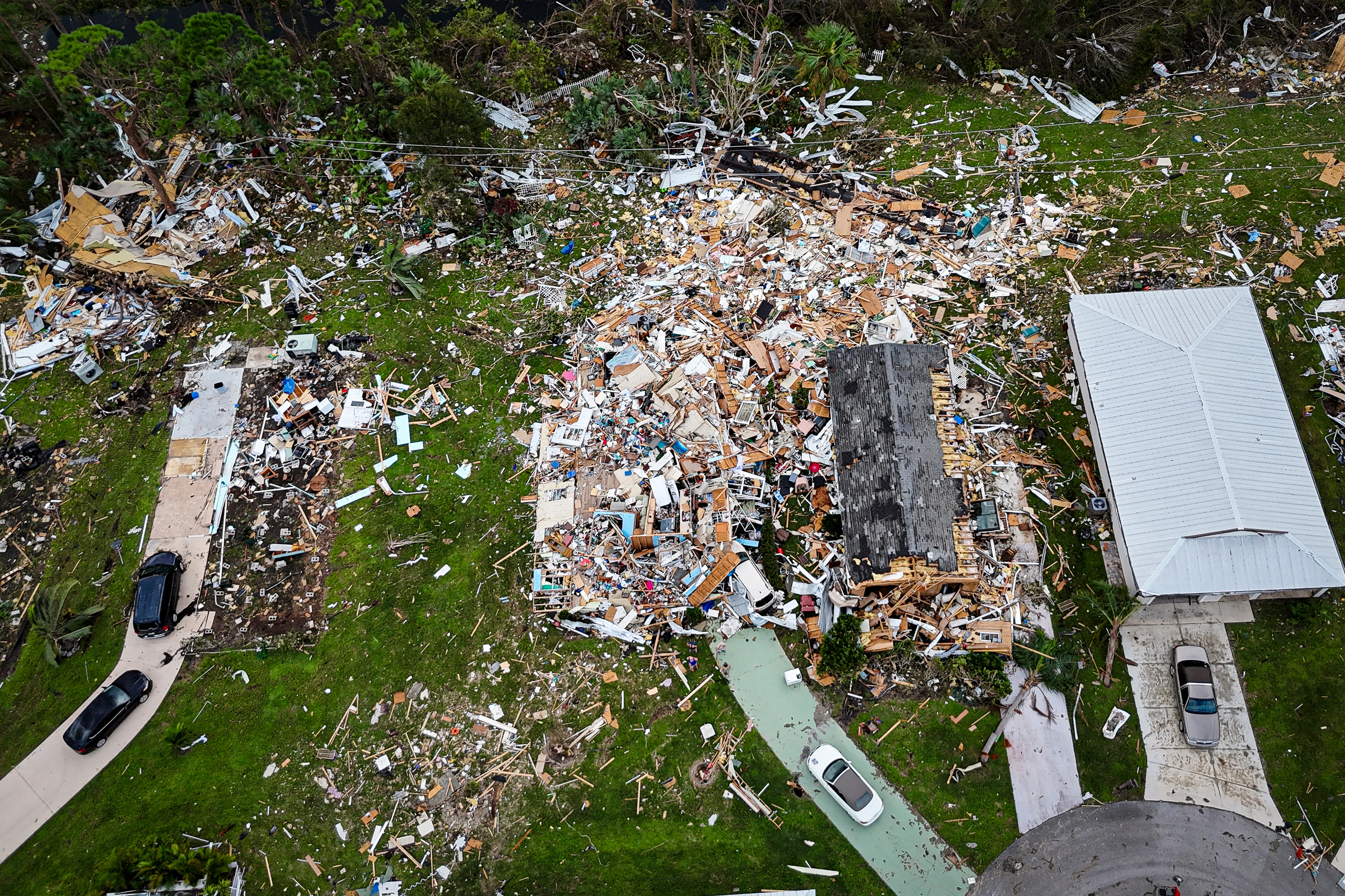 Aerial view of destroyed houses in Port St Lucie, Florida, after a tornado hit the area and caused severe damage as Hurricane Milton swept through Florida